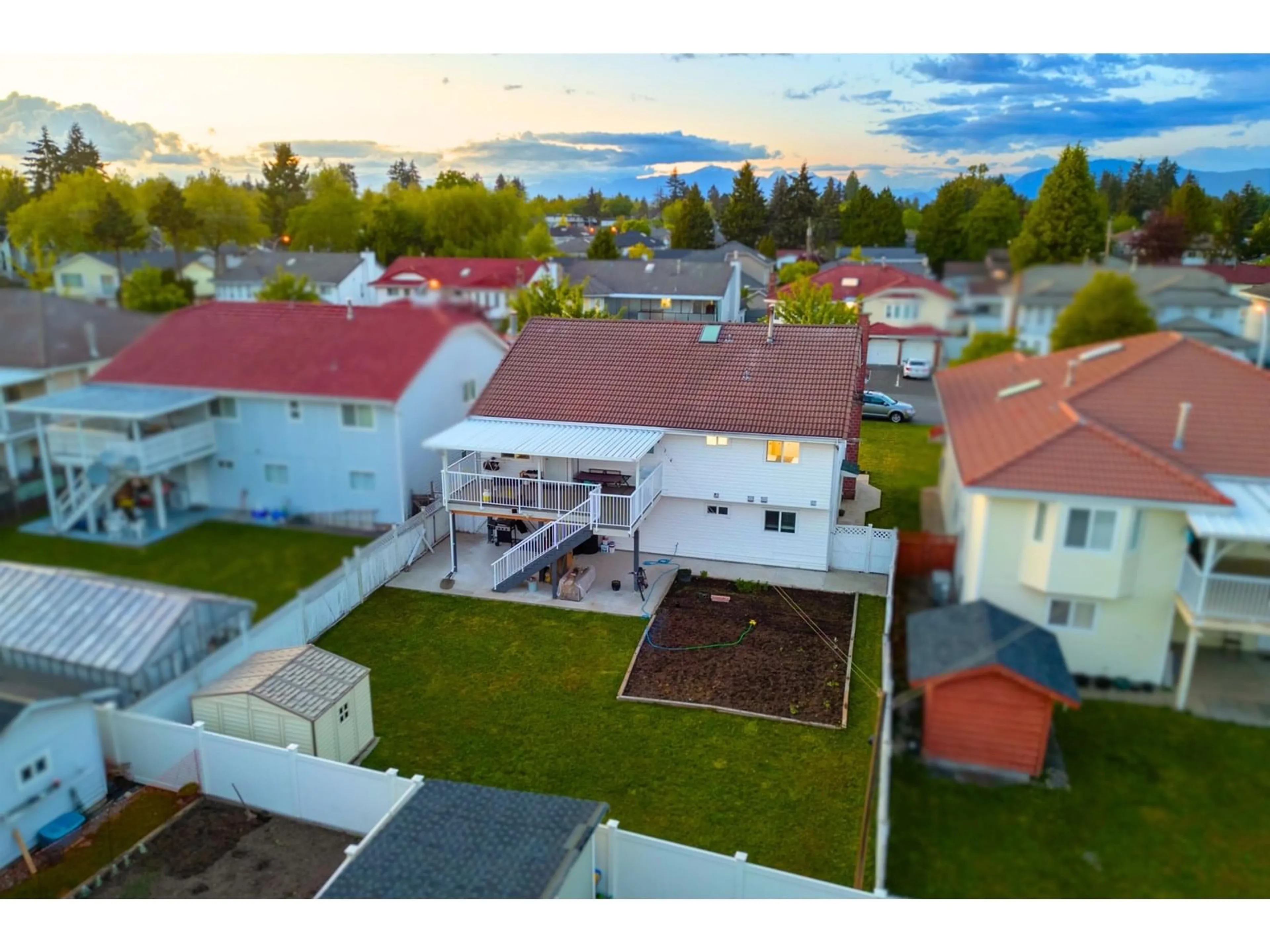 A pic from outside/outdoor area/front of a property/back of a property/a pic from drone, street for 12452 90A, Surrey British Columbia V3V6T3