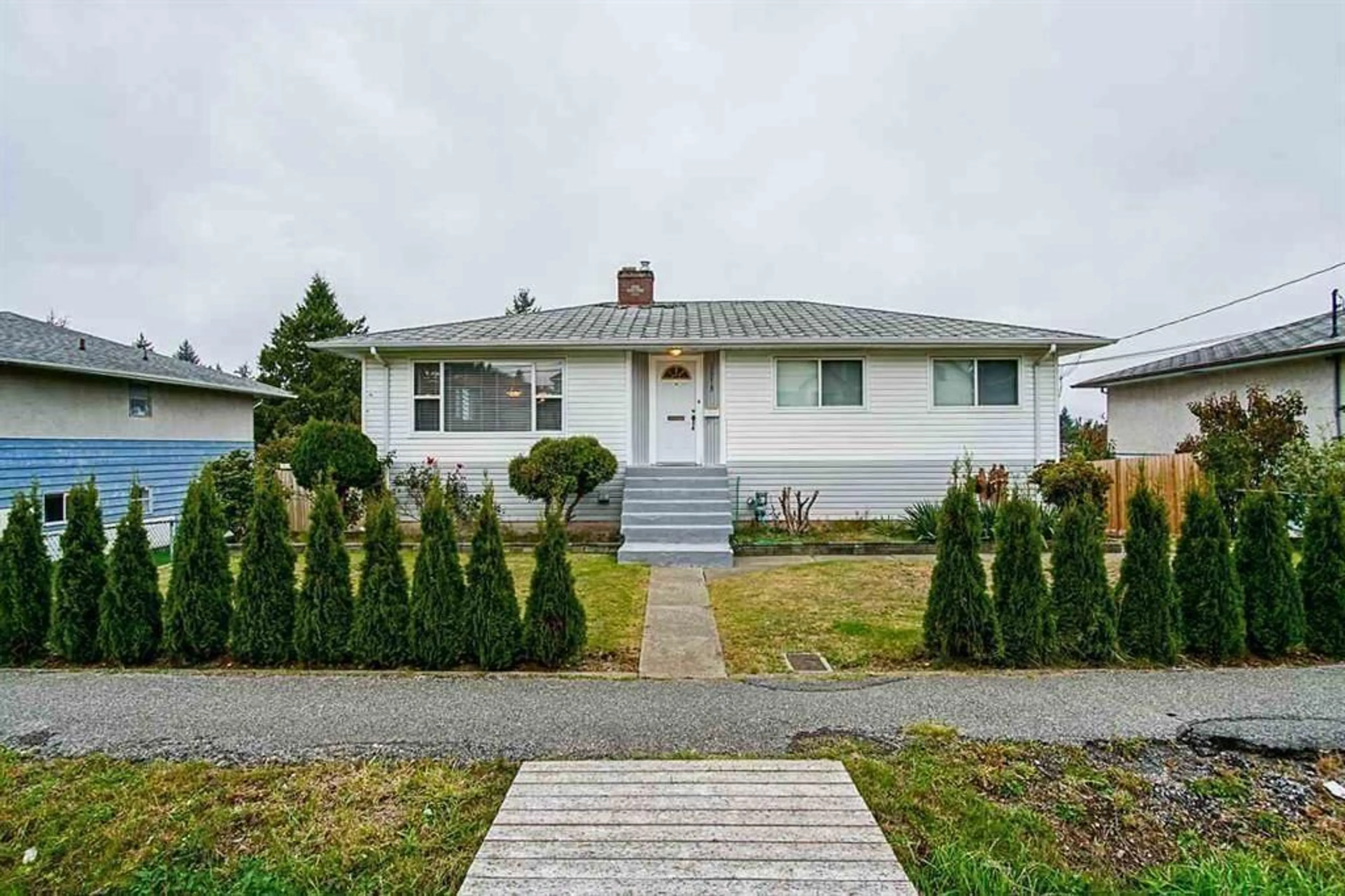 Home with vinyl exterior material, street for 12219 99, Surrey British Columbia V3V2N6