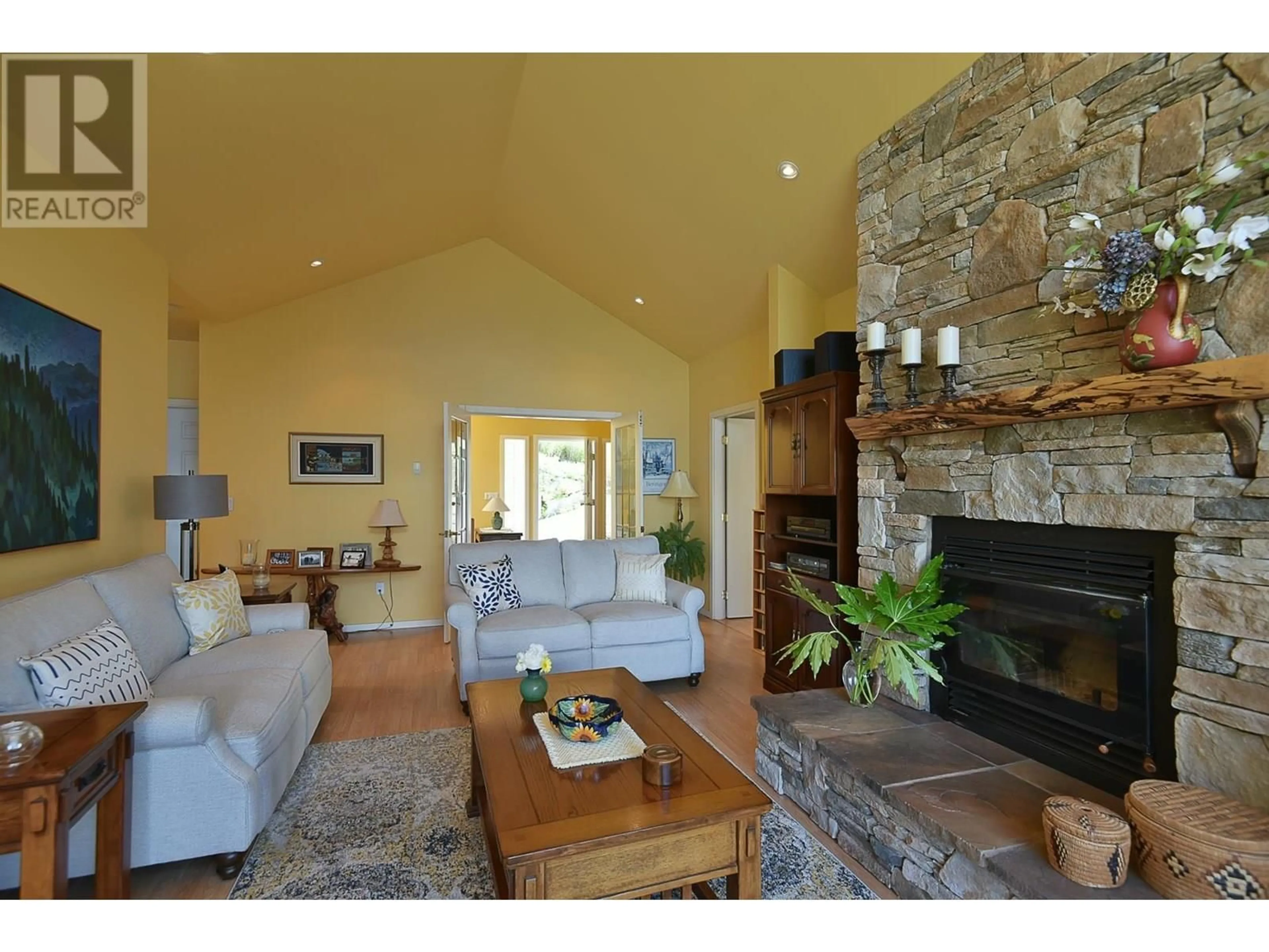 Living room with furniture, wood/laminate floor for 5870 SKOOKUMCHUK ROAD, Sechelt British Columbia V7Z0P3