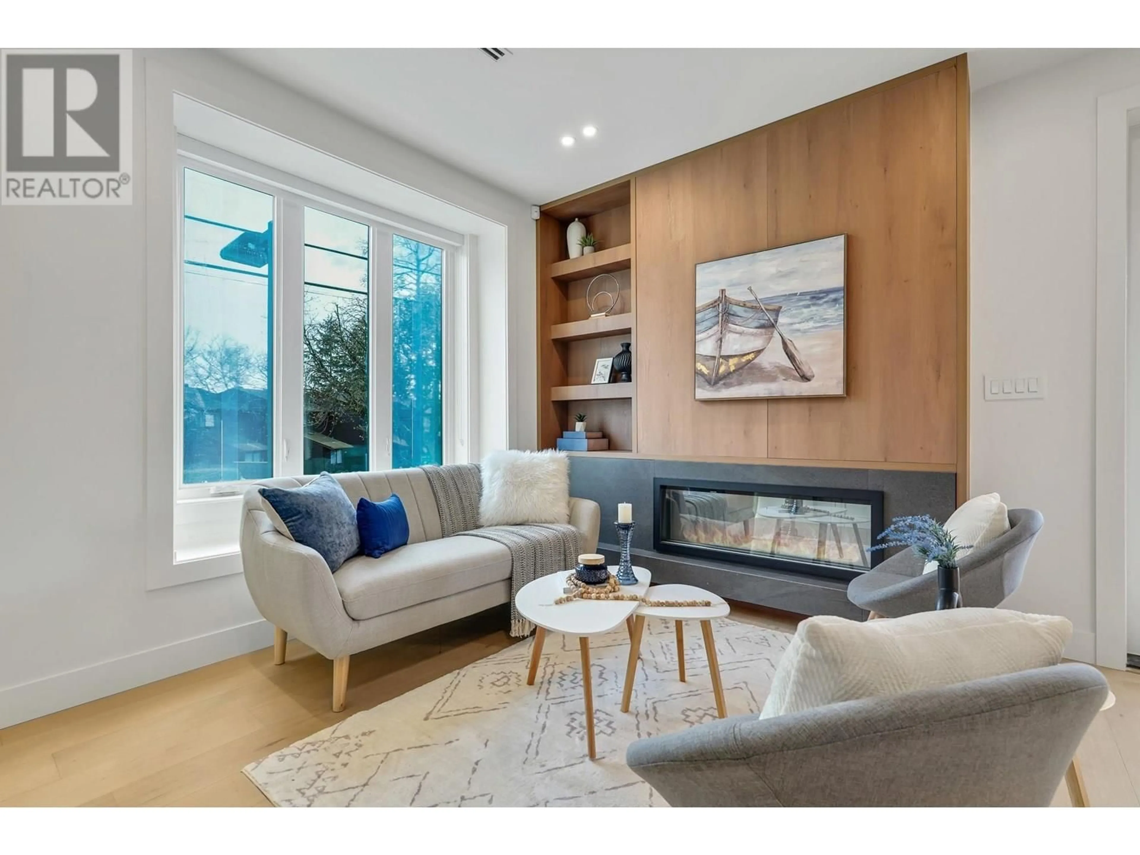 Living room with furniture, wood/laminate floor for 3483 ADANAC STREET, Vancouver British Columbia V5K4P4