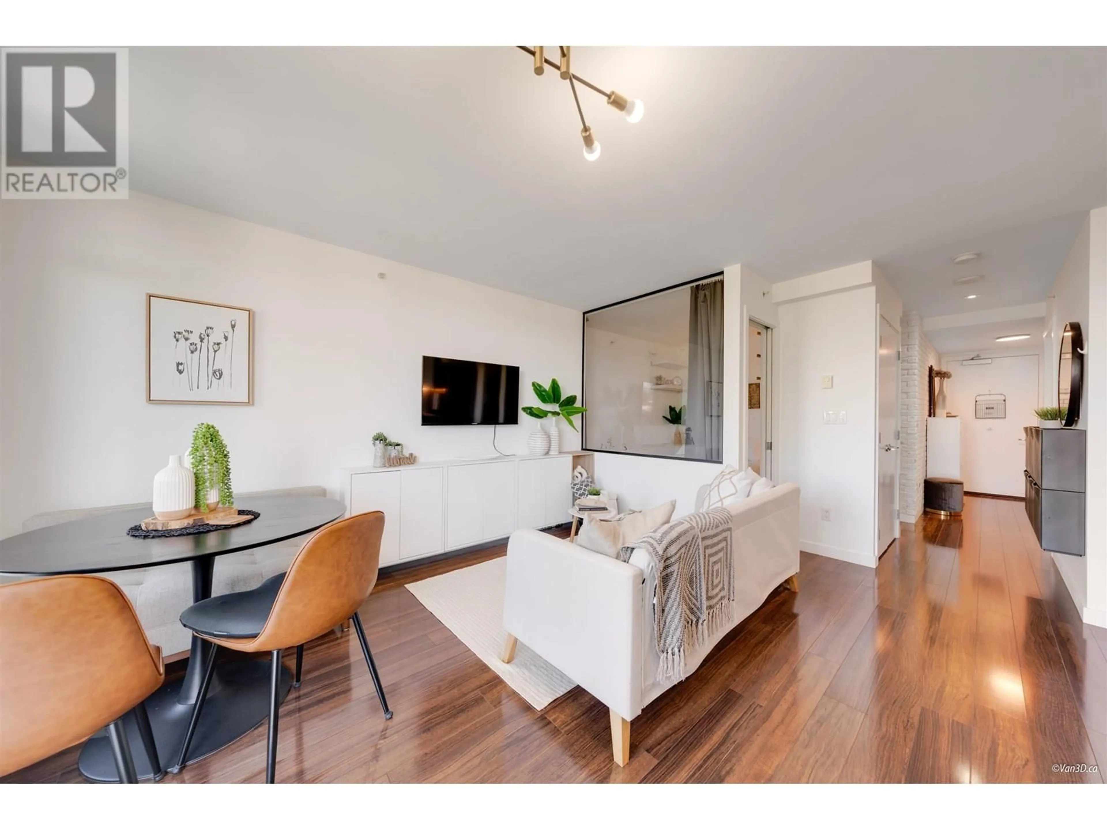 Living room with furniture, wood/laminate floor for 312 - 4888 NANAIMO STREET, Vancouver British Columbia V5N0B5