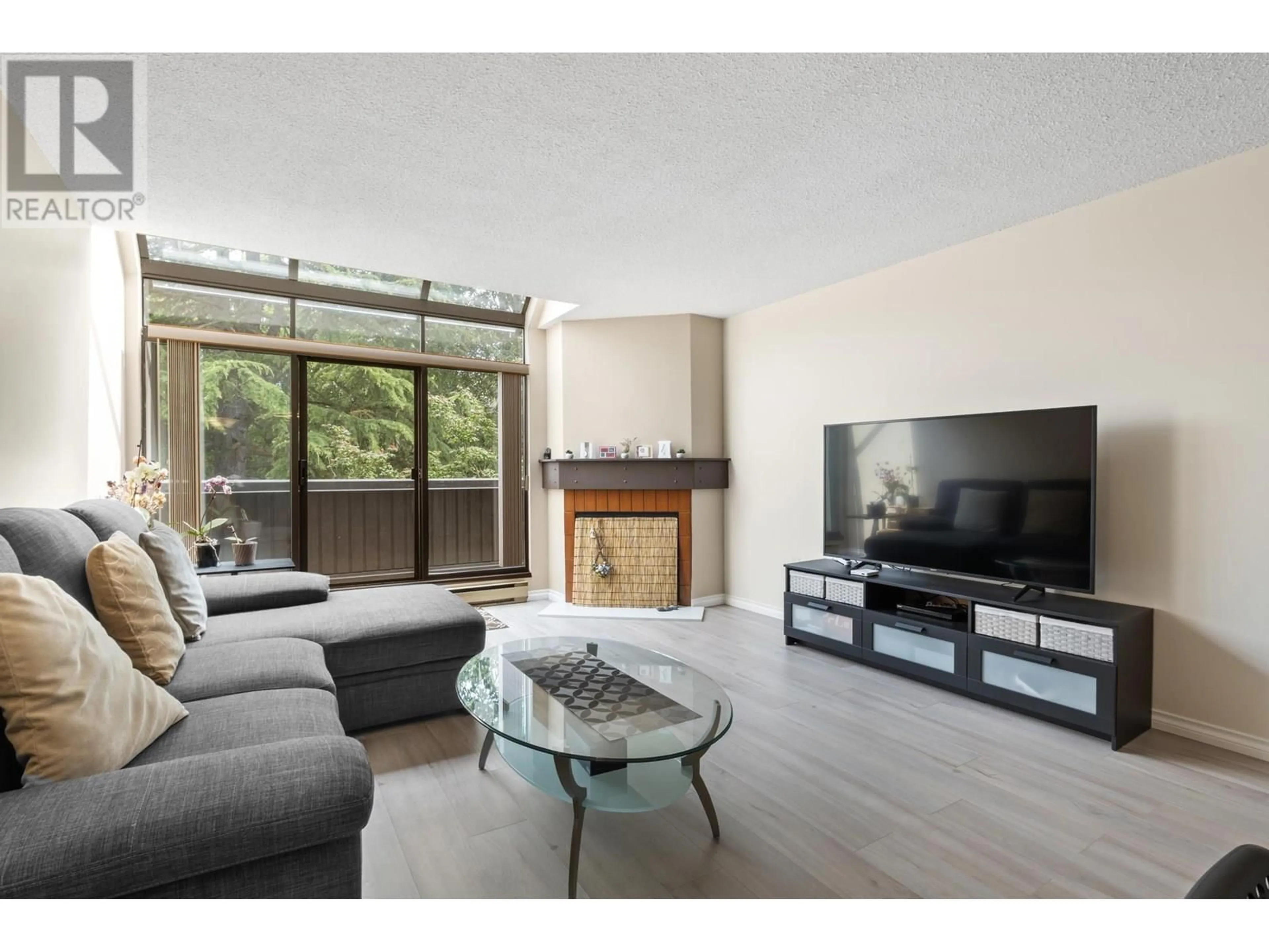 Living room with furniture, wood/laminate floor for 220 - 7340 MOFFATT ROAD, Richmond British Columbia V6Y1X8