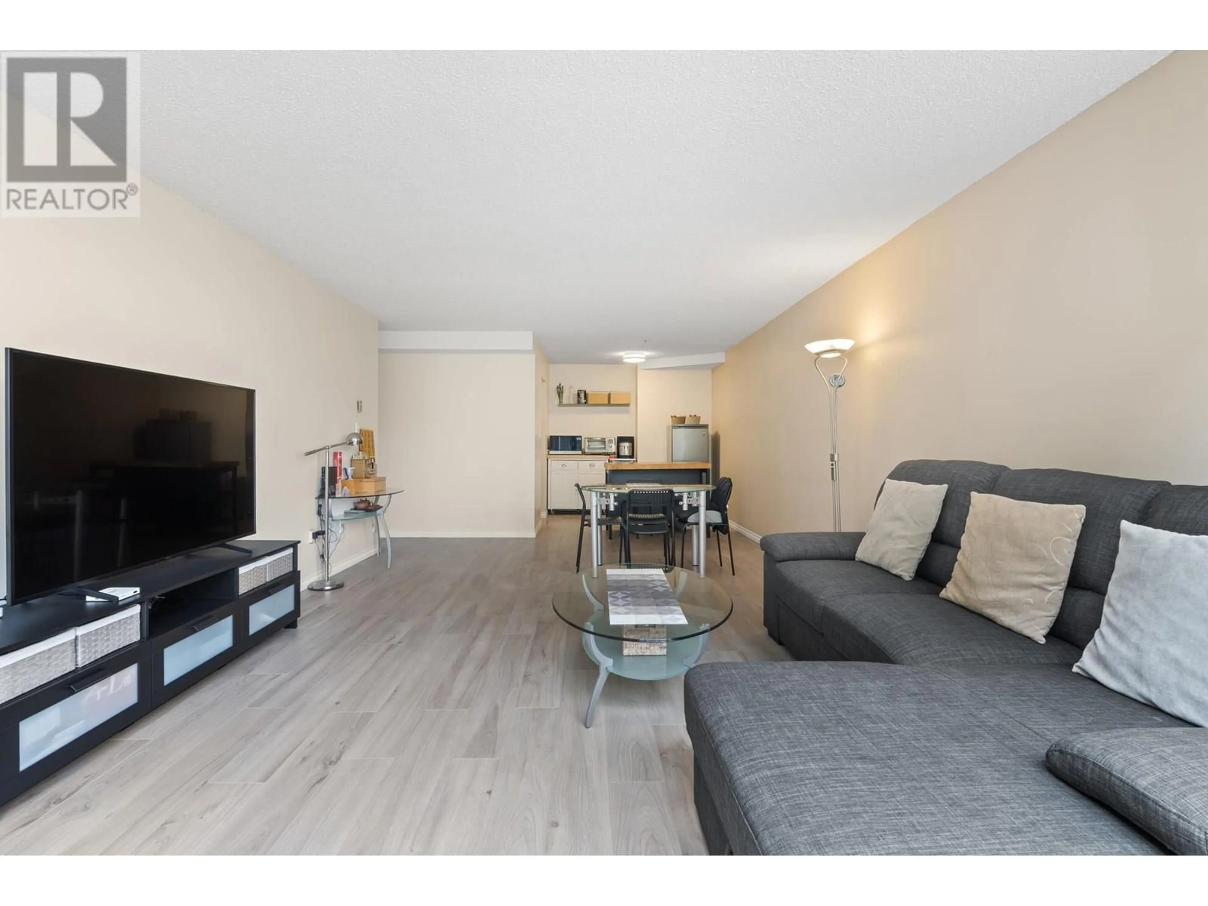 Living room with furniture, wood/laminate floor for 220 - 7340 MOFFATT ROAD, Richmond British Columbia V6Y1X8