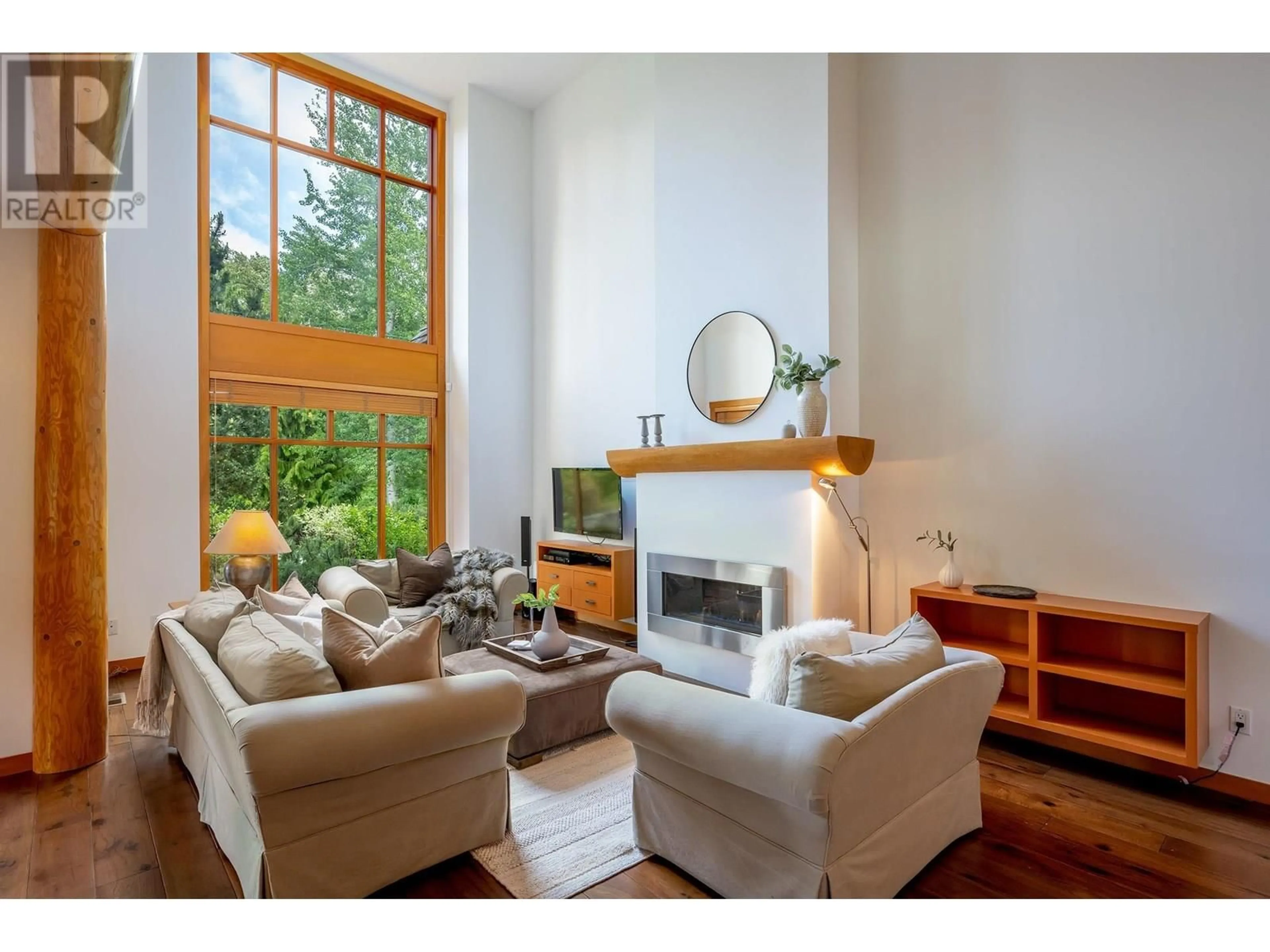 Living room with furniture, wood/laminate floor for 8398 GLEN ABBEY LANE, Whistler British Columbia V8E1J7