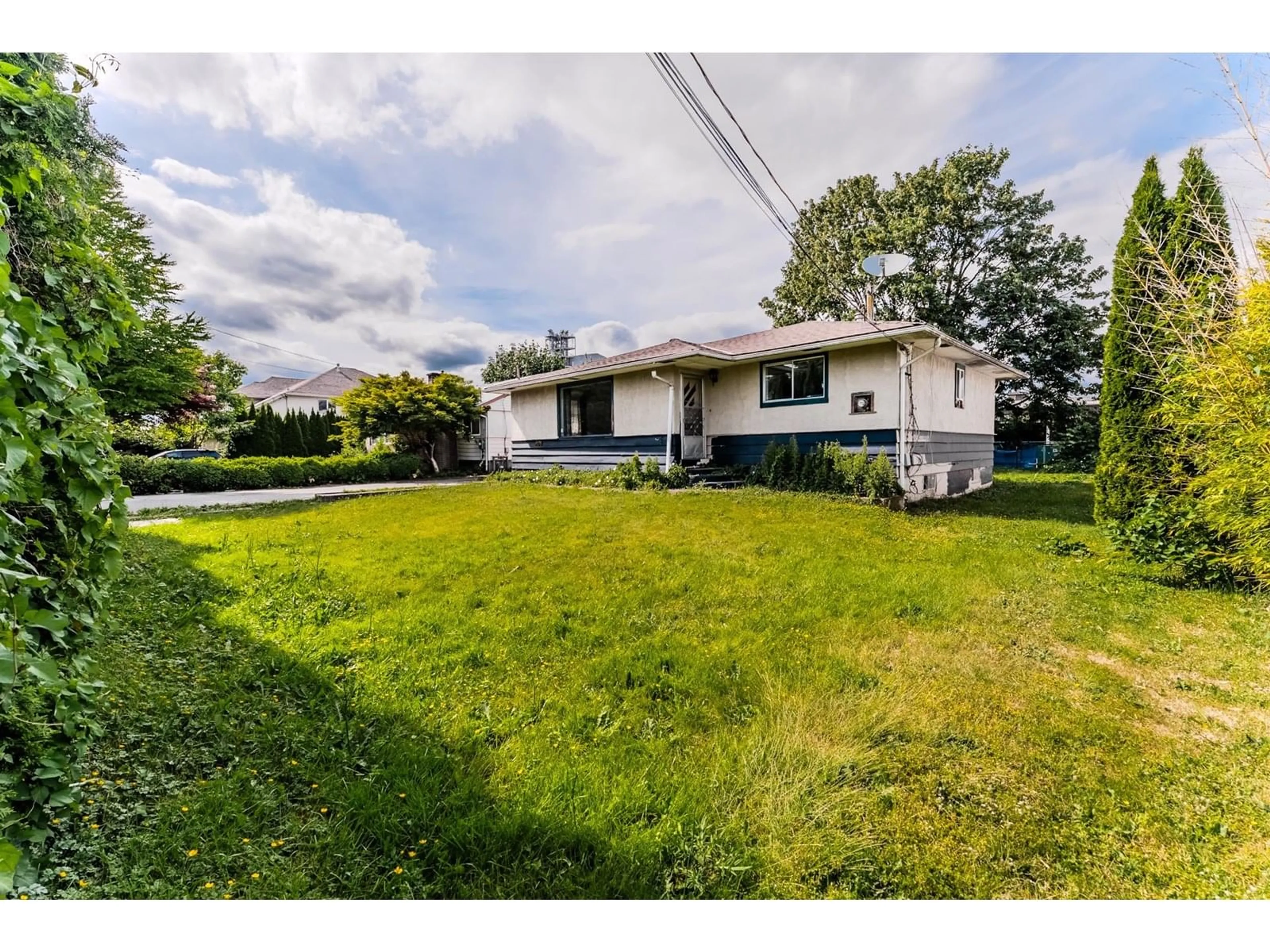 A pic from outside/outdoor area/front of a property/back of a property/a pic from drone, street for 46295 CHILLIWACK CENTRAL ROAD, Chilliwack British Columbia V2P1J7