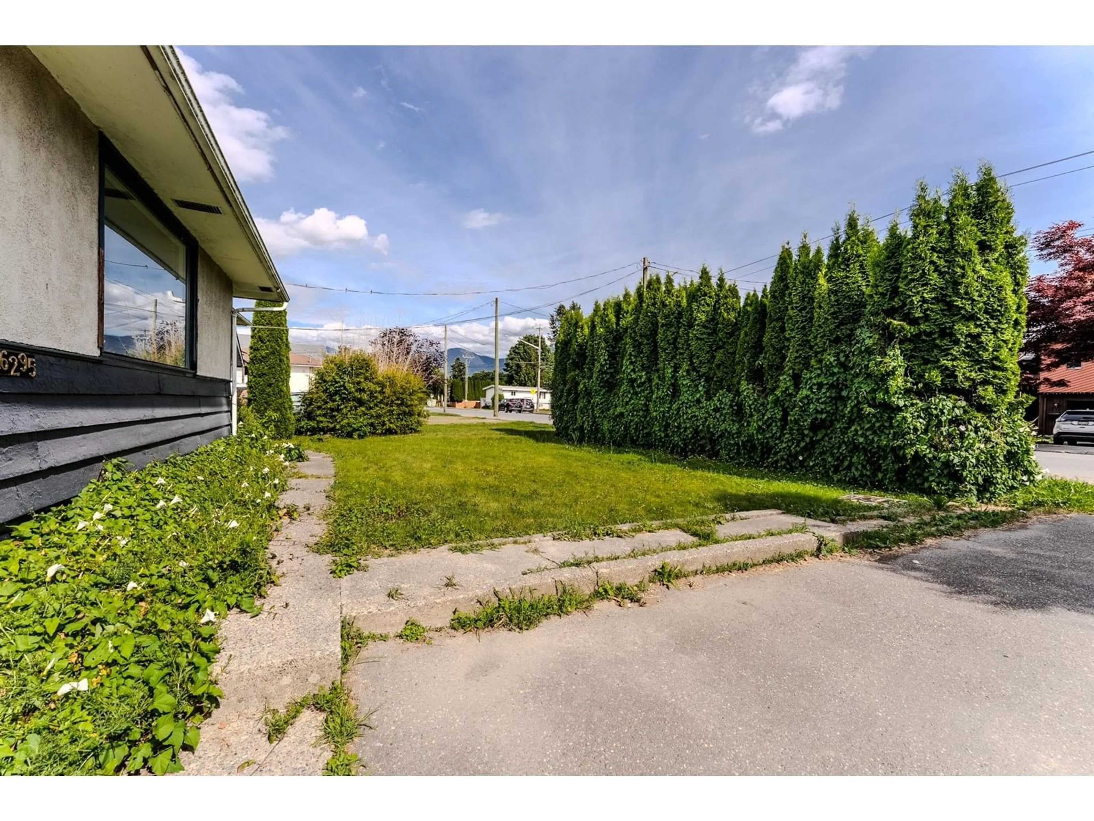 A pic from outside/outdoor area/front of a property/back of a property/a pic from drone, mountain view for 46295 CHILLIWACK CENTRAL ROAD, Chilliwack British Columbia V2P1J7