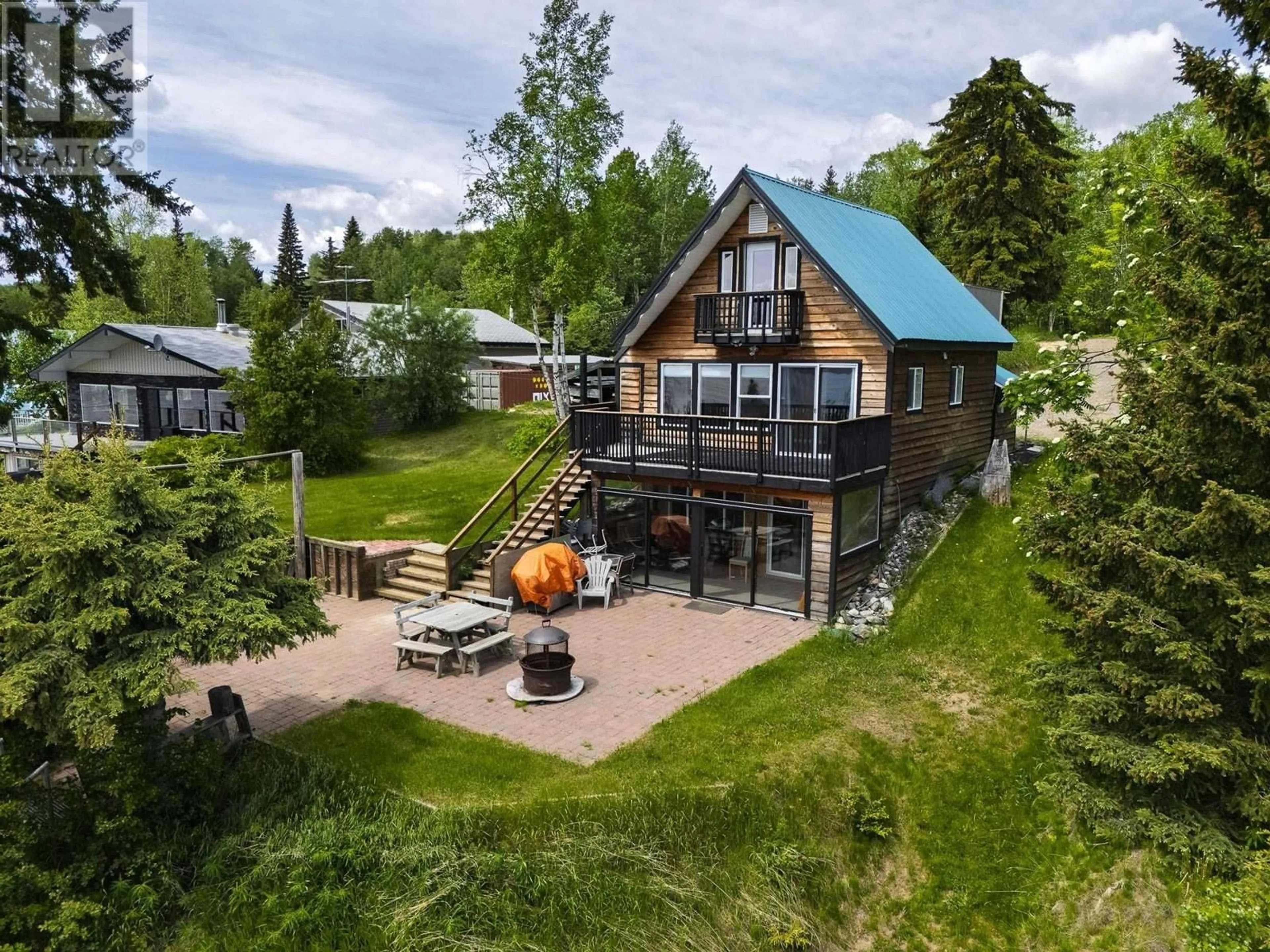A pic from outside/outdoor area/front of a property/back of a property/a pic from drone, water/lake/river/ocean view for 25755 NESS LAKE ROAD, Prince George British Columbia V2K5N3