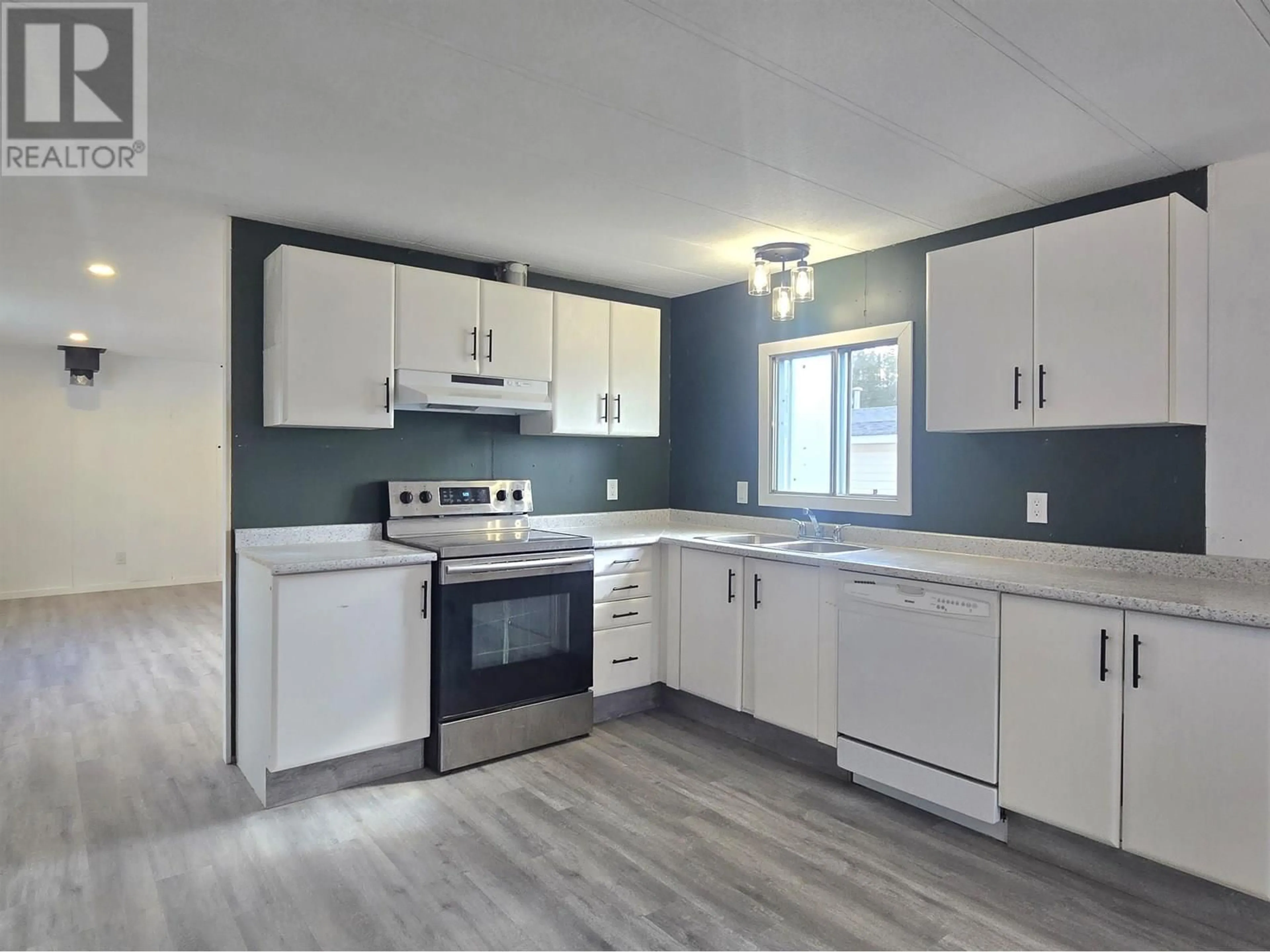 Open concept kitchen, unknown for 18 - 5378 PARK DRIVE, 100 Mile House British Columbia V0K2E1