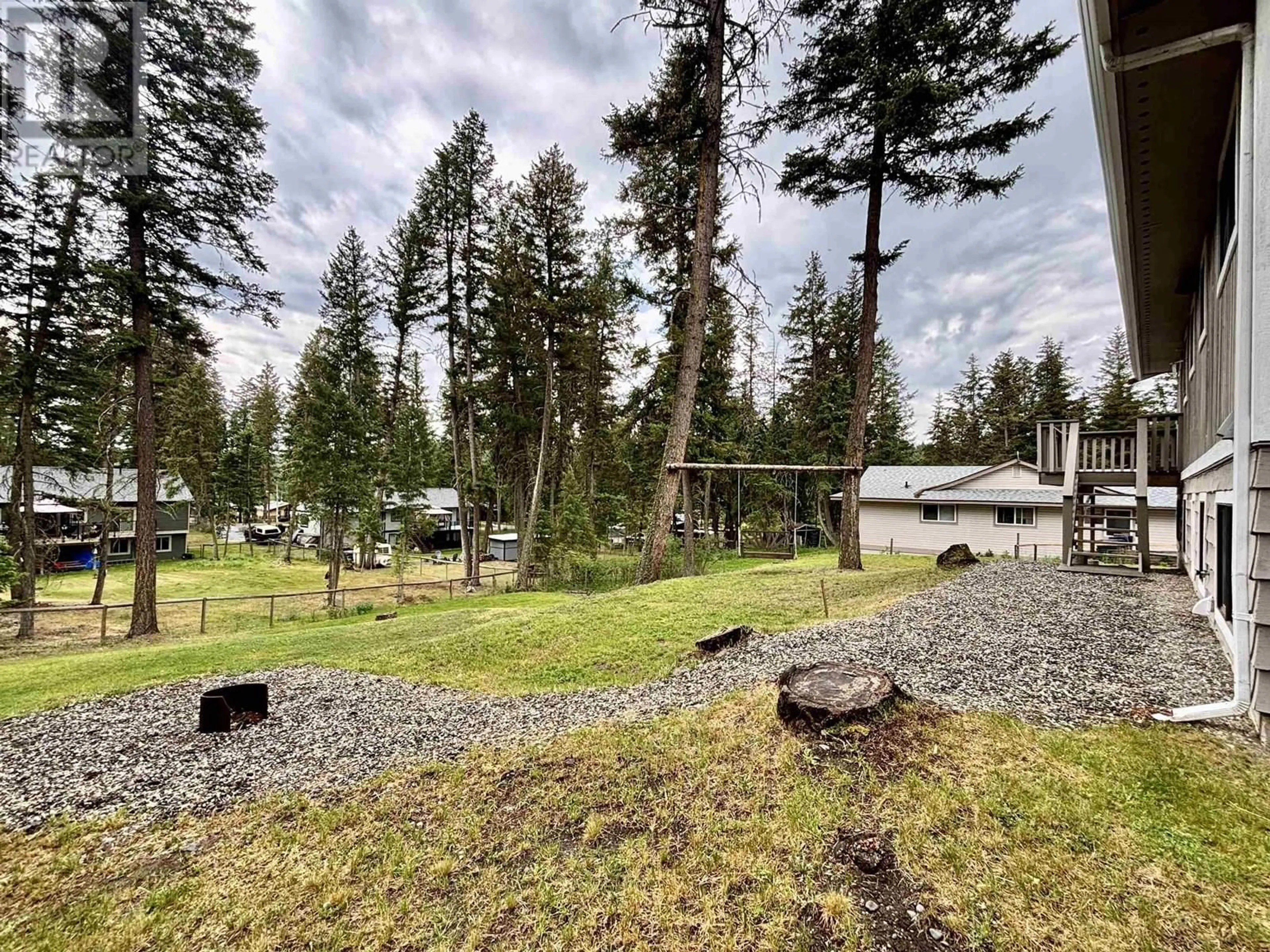 A pic from outside/outdoor area/front of a property/back of a property/a pic from drone, forest/trees view for 5336 ANNAHAM CRESCENT, 108 Mile Ranch British Columbia V0K2Z0