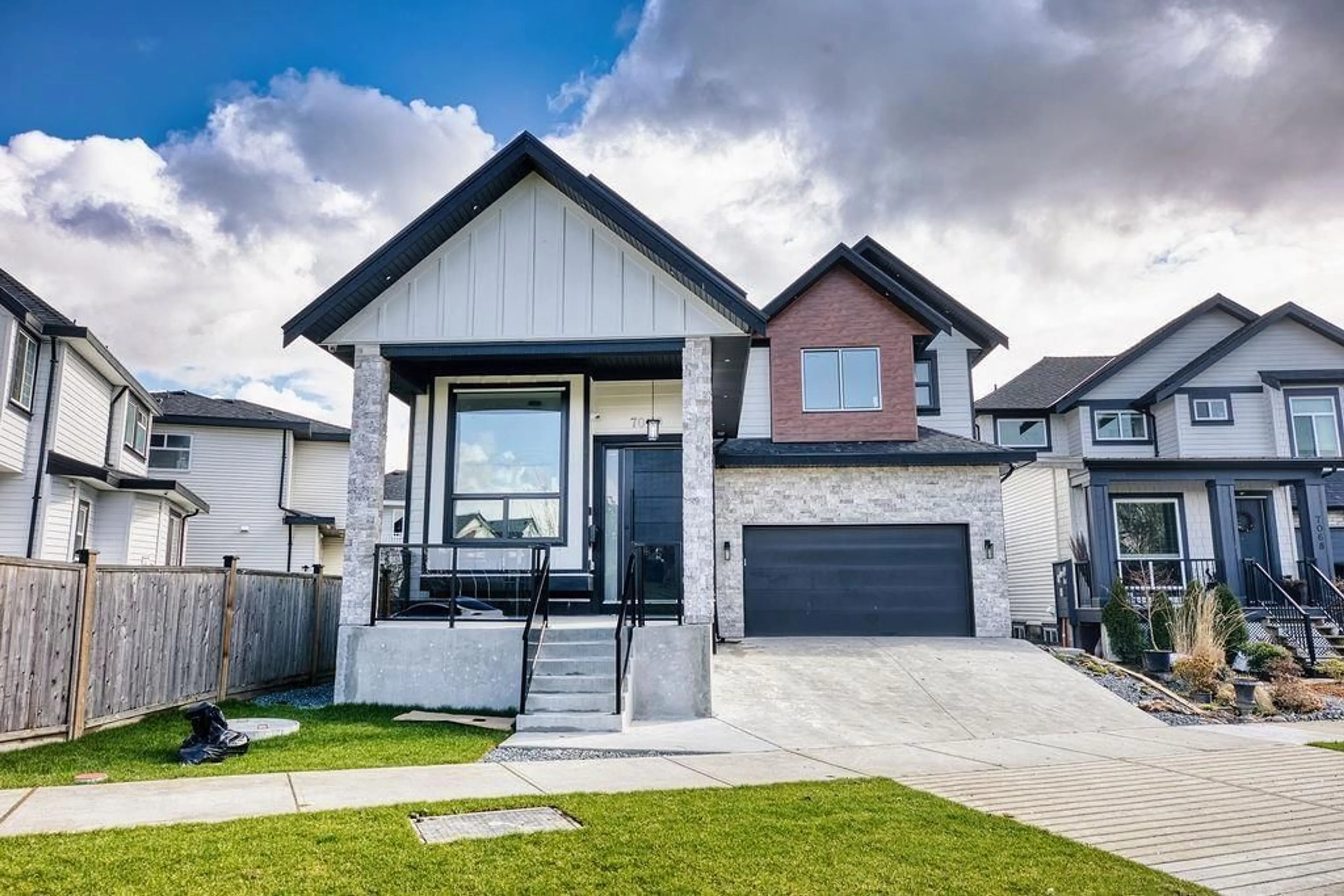 Home with vinyl exterior material, street for 7080 192A, Surrey British Columbia V4N6V1