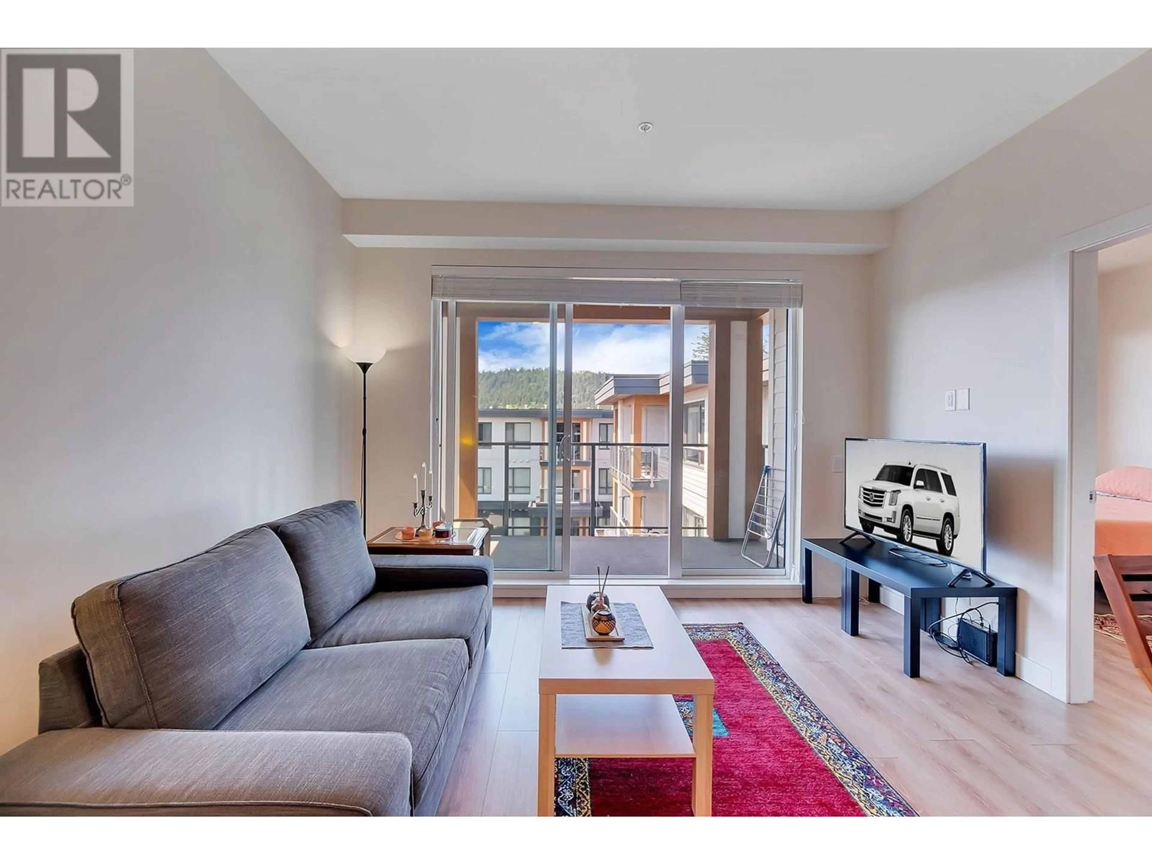 Living room with furniture, wood/laminate floor for 620 - 721 ANSKAR COURT, Coquitlam British Columbia V3J0L4