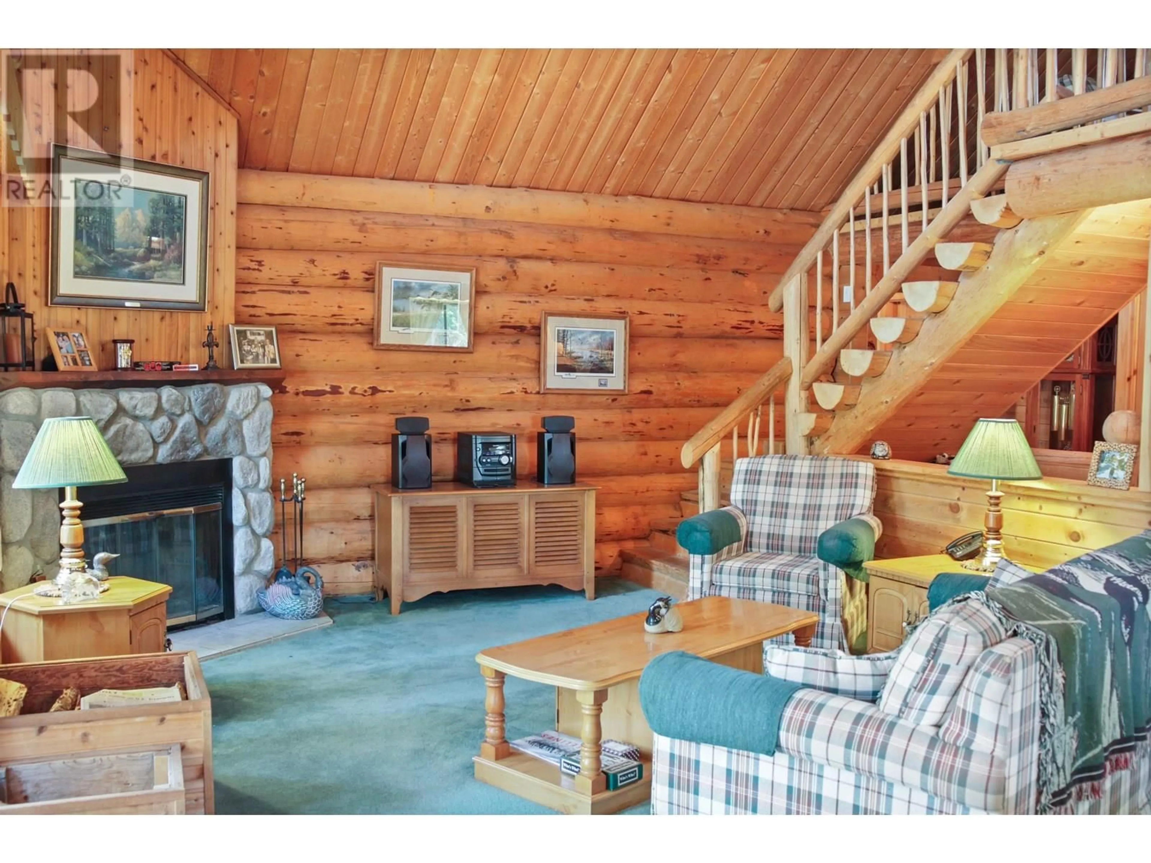 Living room with furniture, wood/laminate floor for 6437 SHORE COURT, Green Lake British Columbia V0K2K2