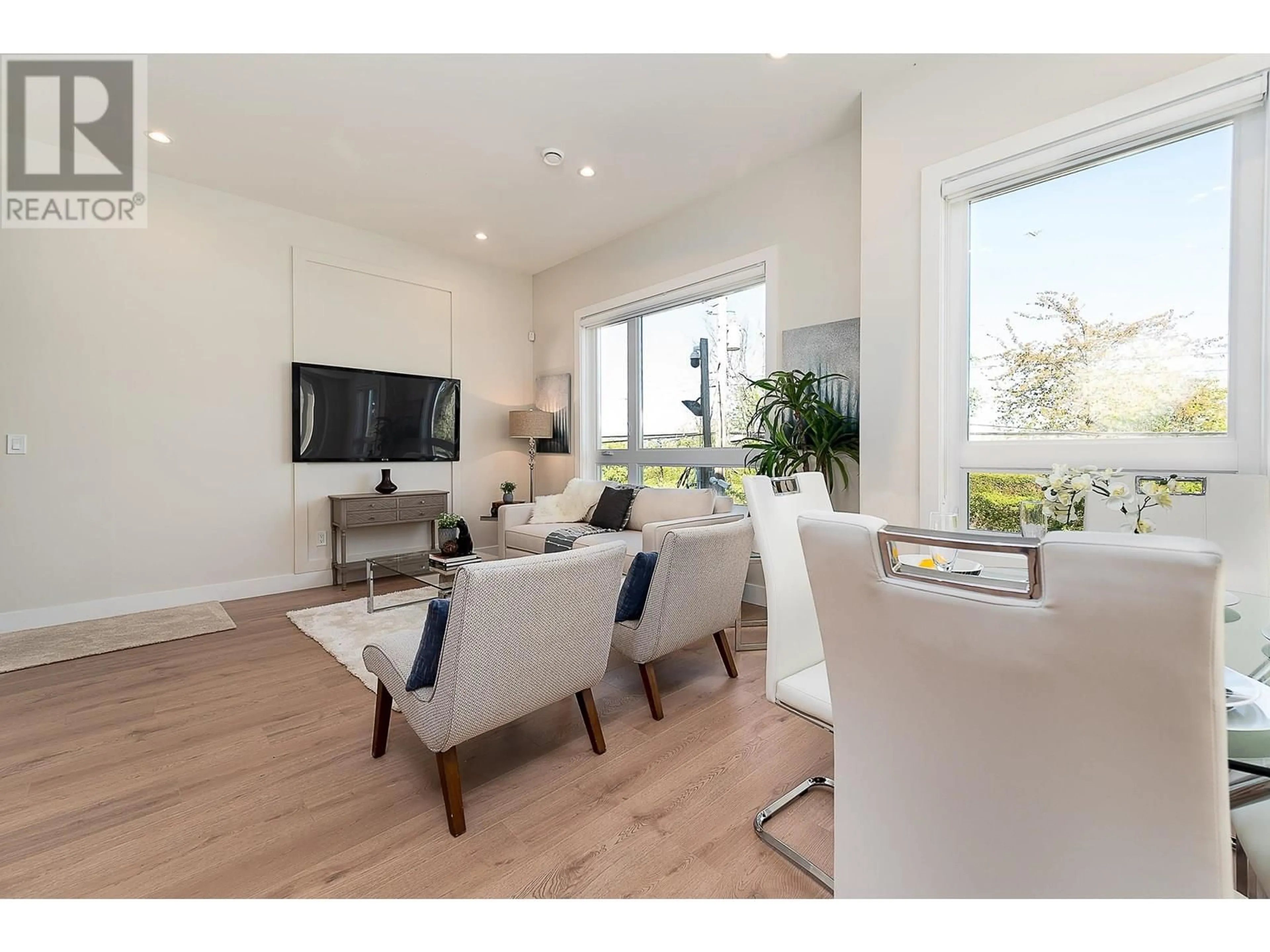 Living room with furniture, wood/laminate floor for 9 - 3033 SHELL ROAD, Richmond British Columbia V6X0B8