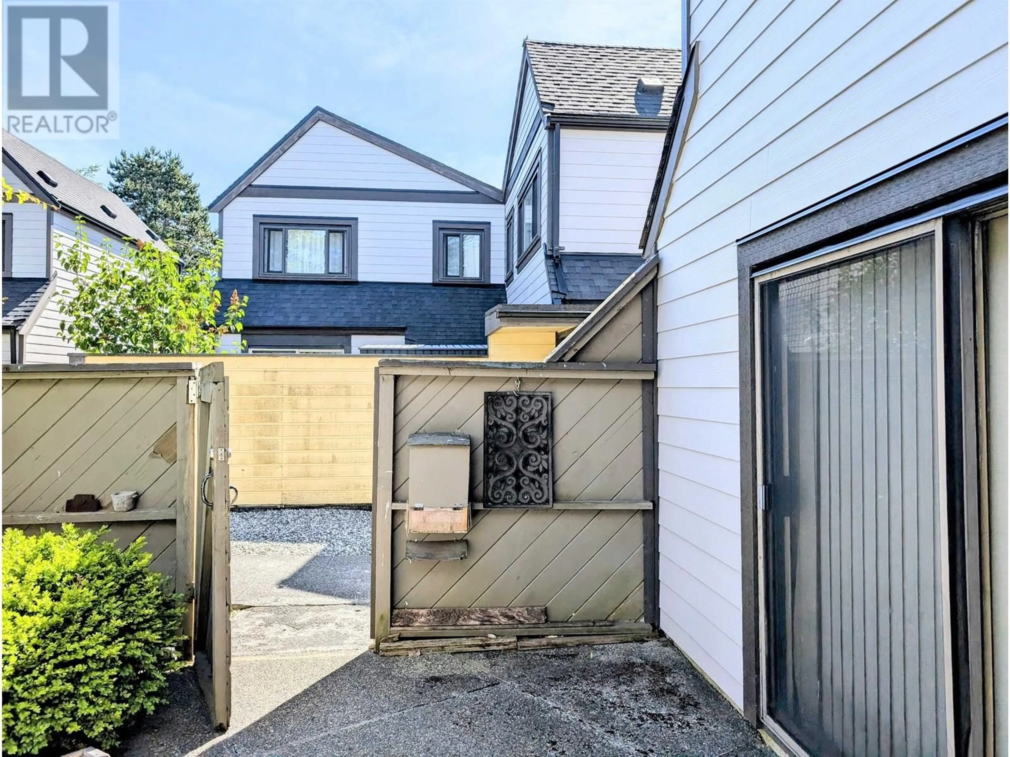 A pic from outside/outdoor area/front of a property/back of a property/a pic from drone, street for 129 - 5421 10 AVENUE, Delta British Columbia V4M3T9
