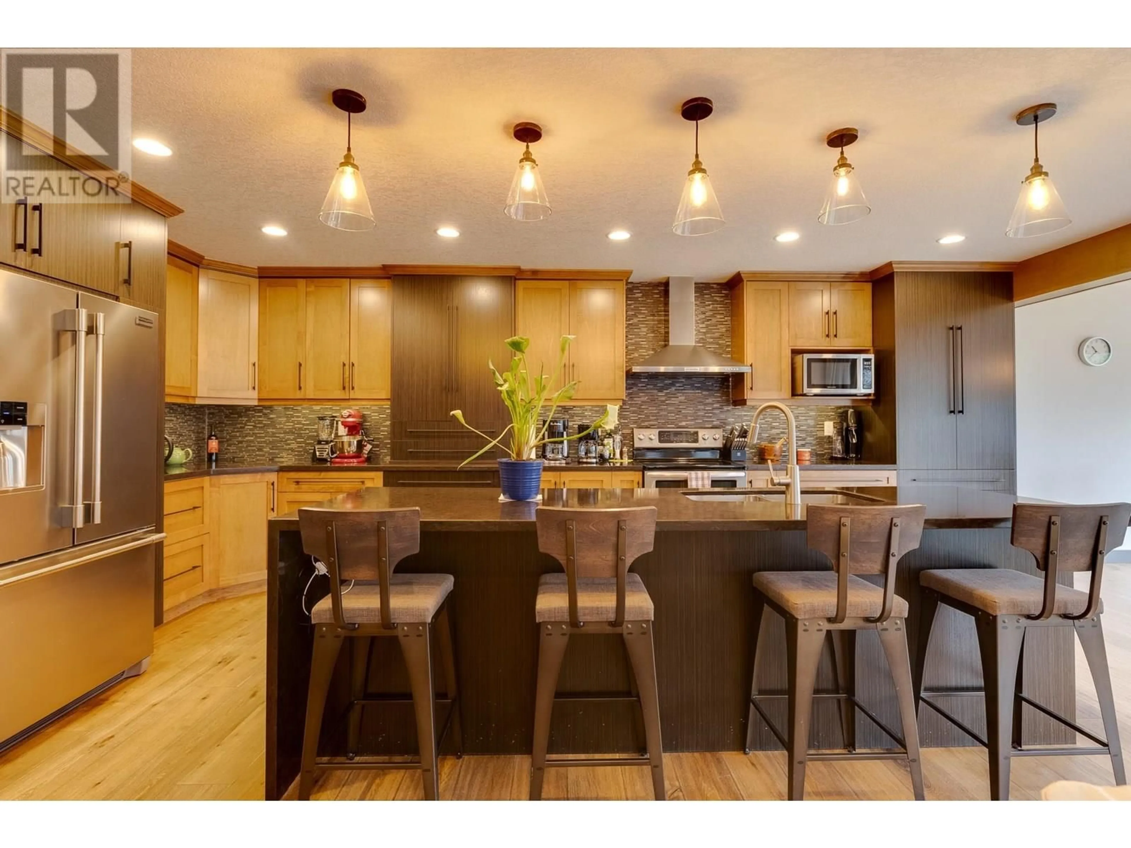 Open concept kitchen, wood/laminate floor for 7664 STILLWATER CRESCENT, Prince George British Columbia V2N0C2