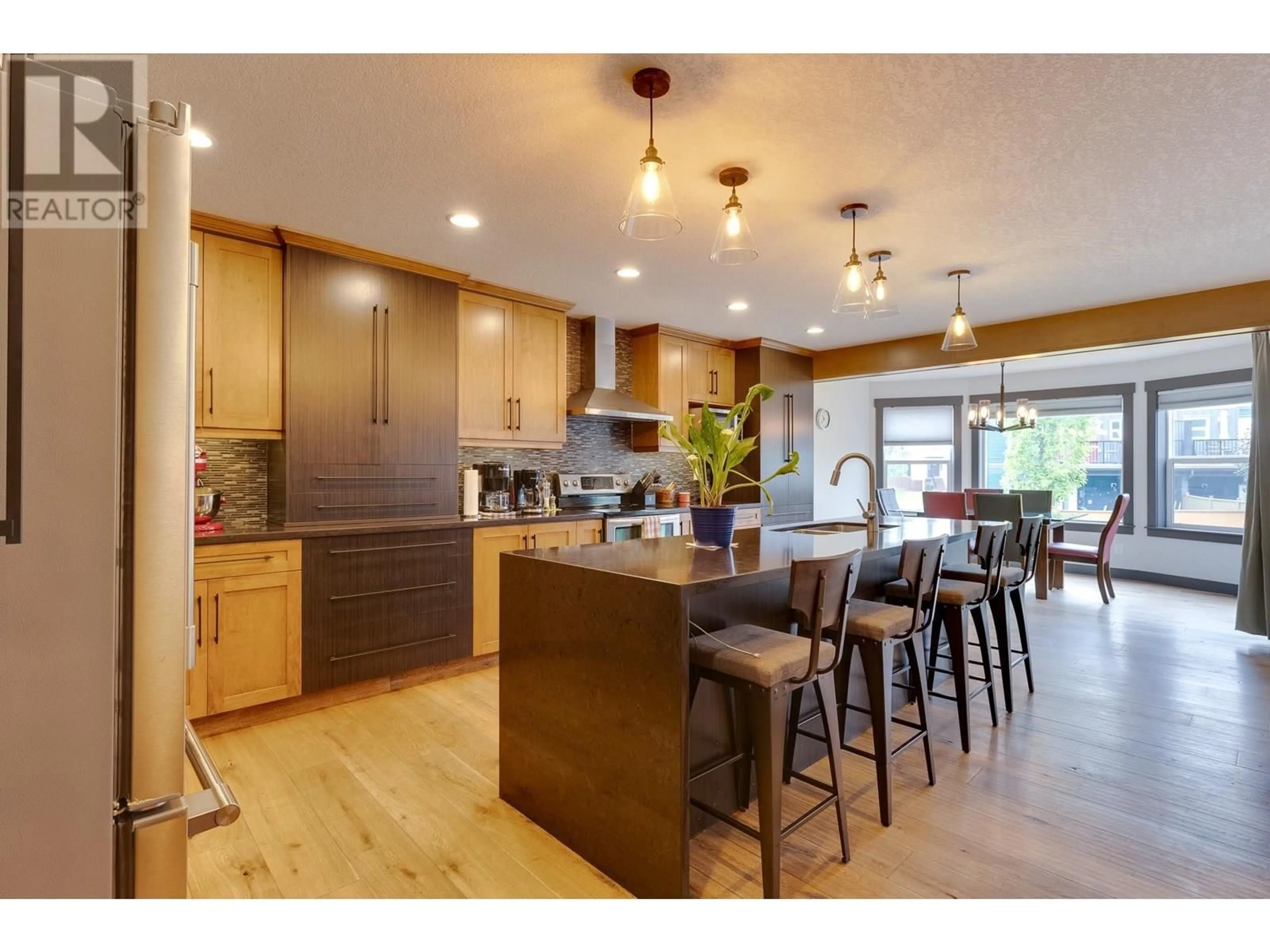 Open concept kitchen, wood/laminate floor for 7664 STILLWATER CRESCENT, Prince George British Columbia V2N0C2