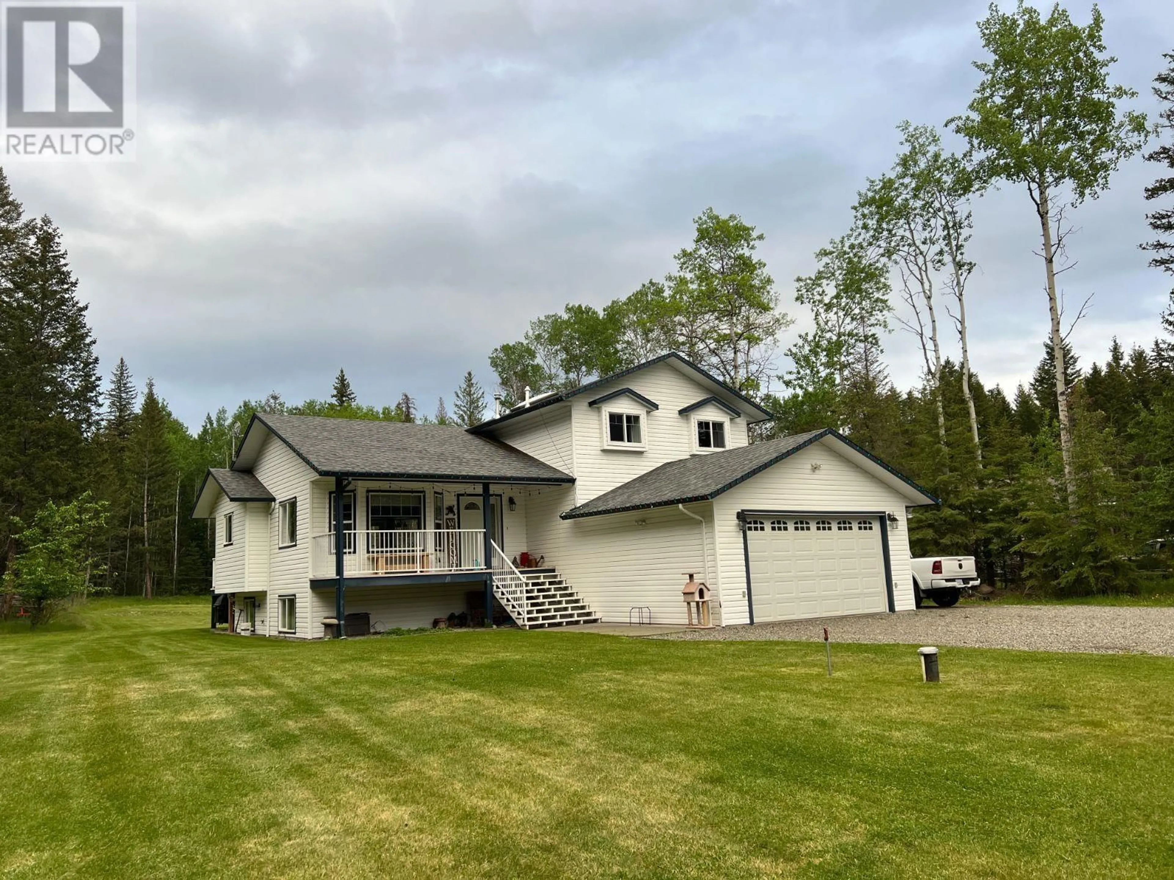 A pic from outside/outdoor area/front of a property/back of a property/a pic from drone, unknown for 140 BORLAND DRIVE, 150 Mile House British Columbia V0K2G0