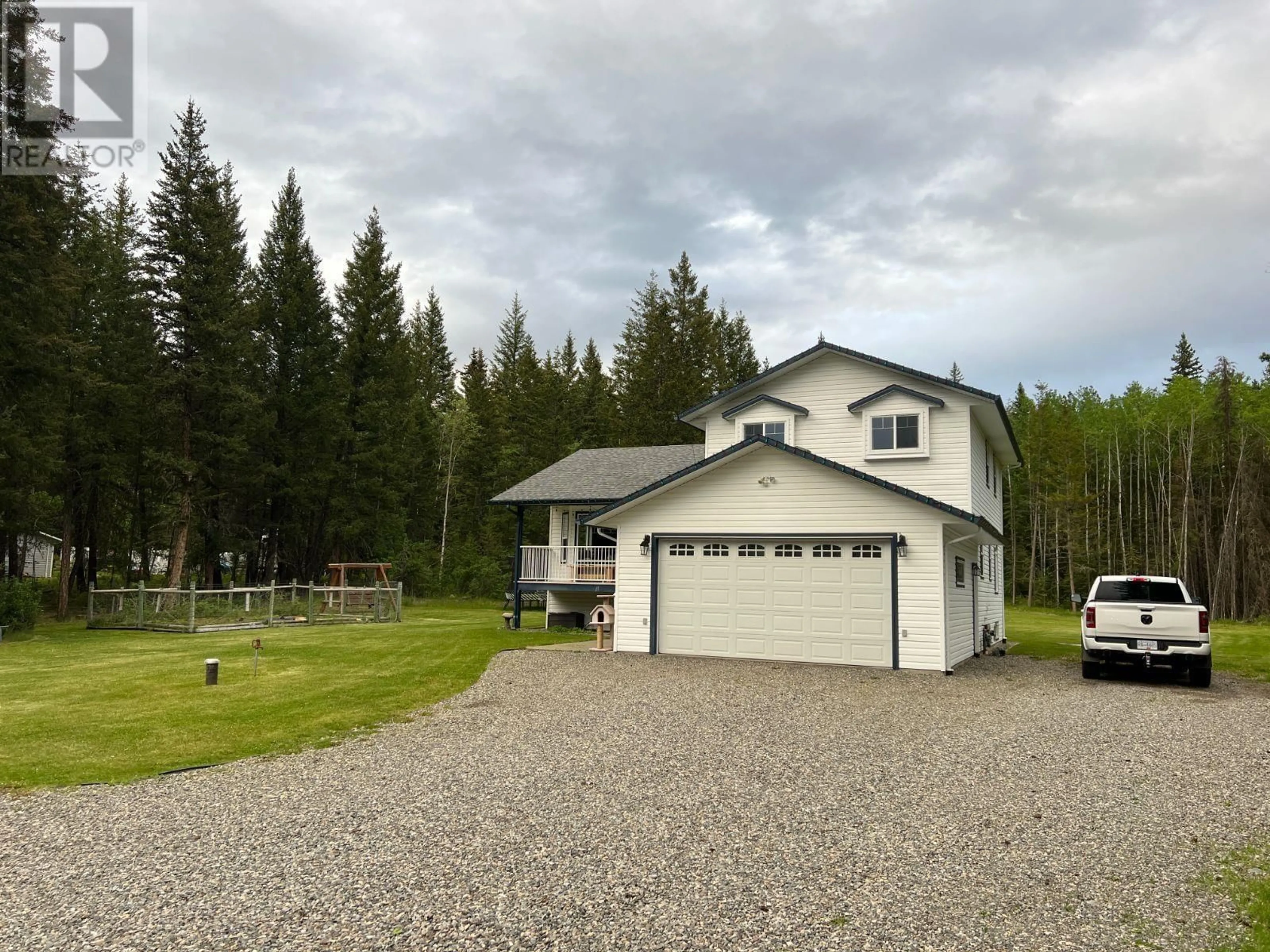 A pic from outside/outdoor area/front of a property/back of a property/a pic from drone, unknown for 140 BORLAND DRIVE, 150 Mile House British Columbia V0K2G0