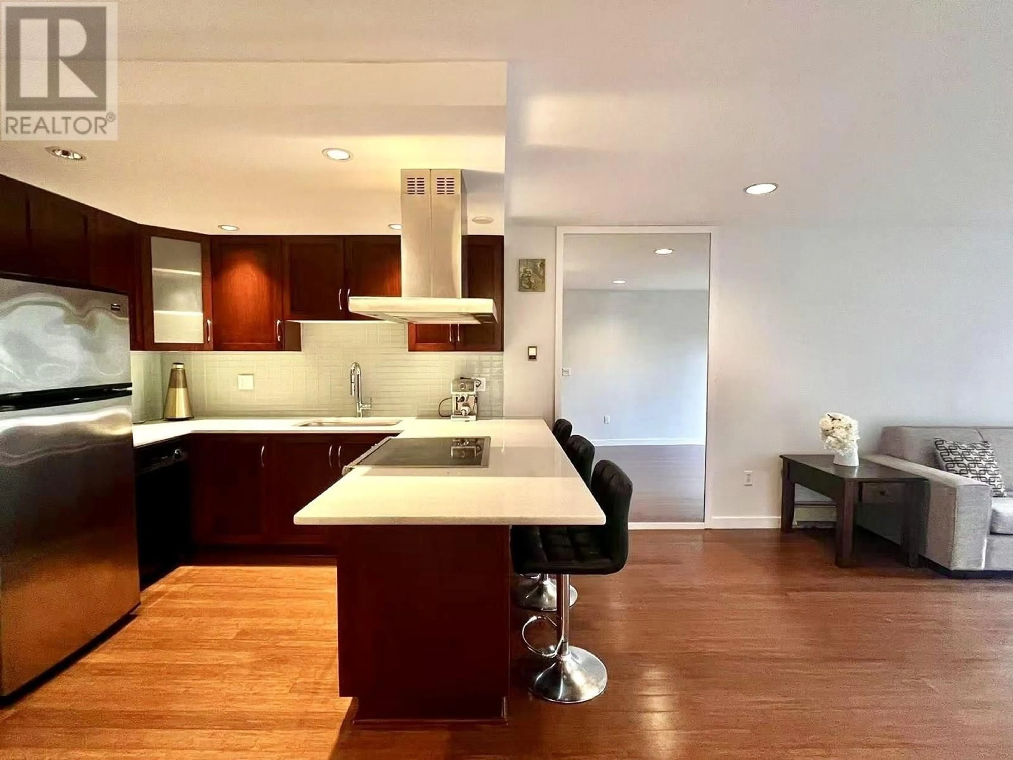 Open concept kitchen, wood/laminate floor for 216 - 3875 4TH AVENUE, Vancouver British Columbia V6R4H8