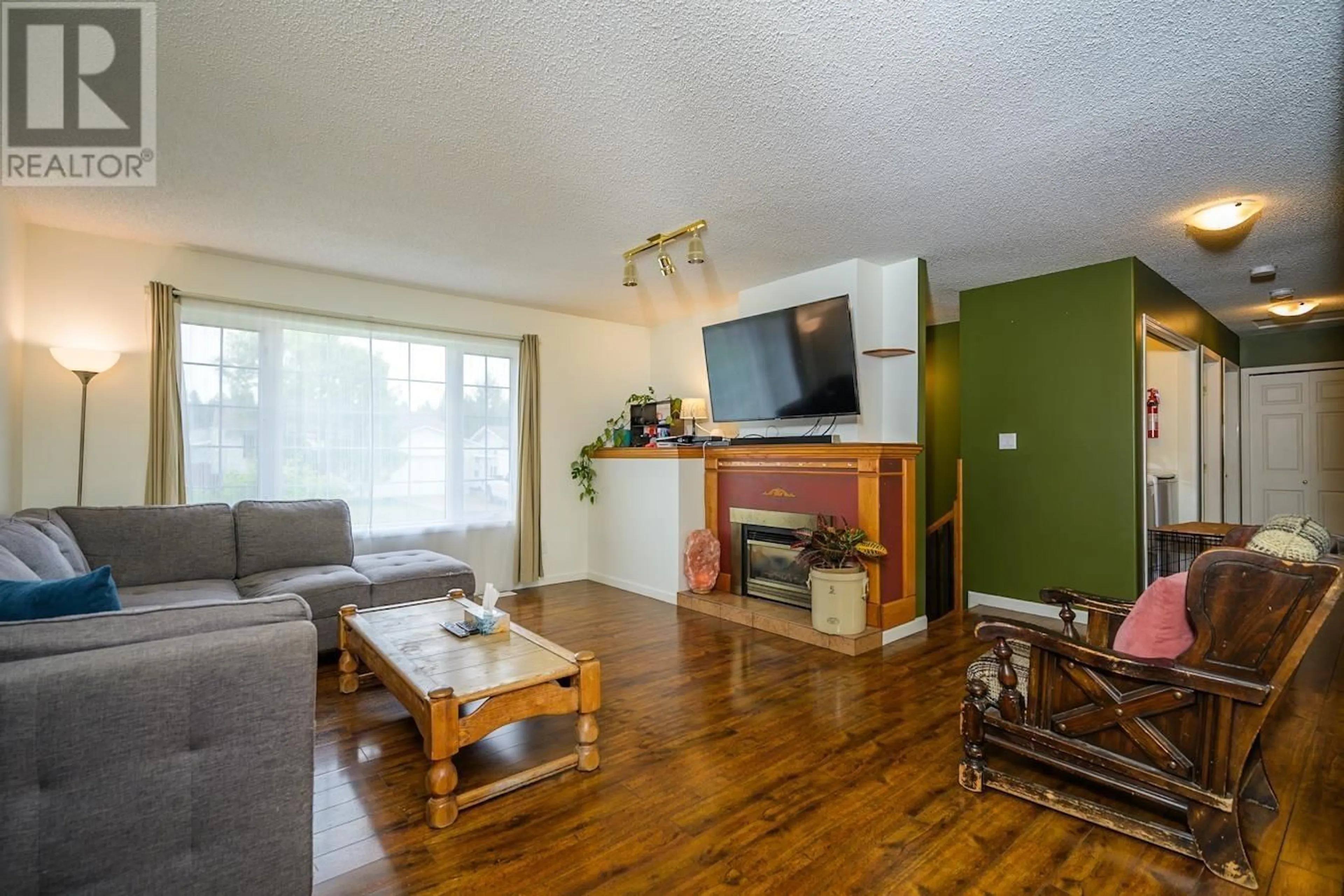 Living room with furniture, wood/laminate floor for 1861 BITTNER ROAD, Prince George British Columbia V2N6T1