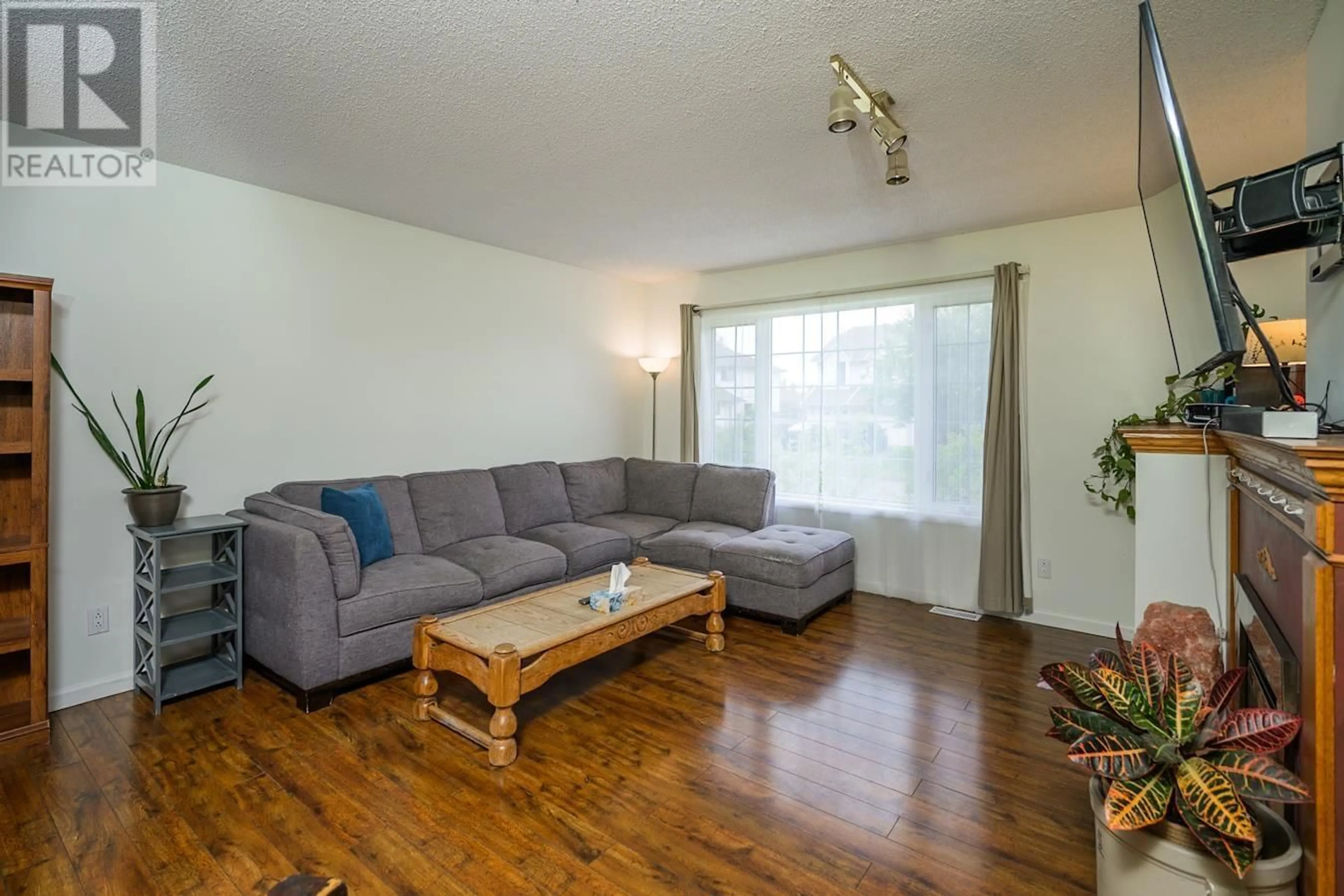 Living room with furniture, wood/laminate floor for 1861 BITTNER ROAD, Prince George British Columbia V2N6T1