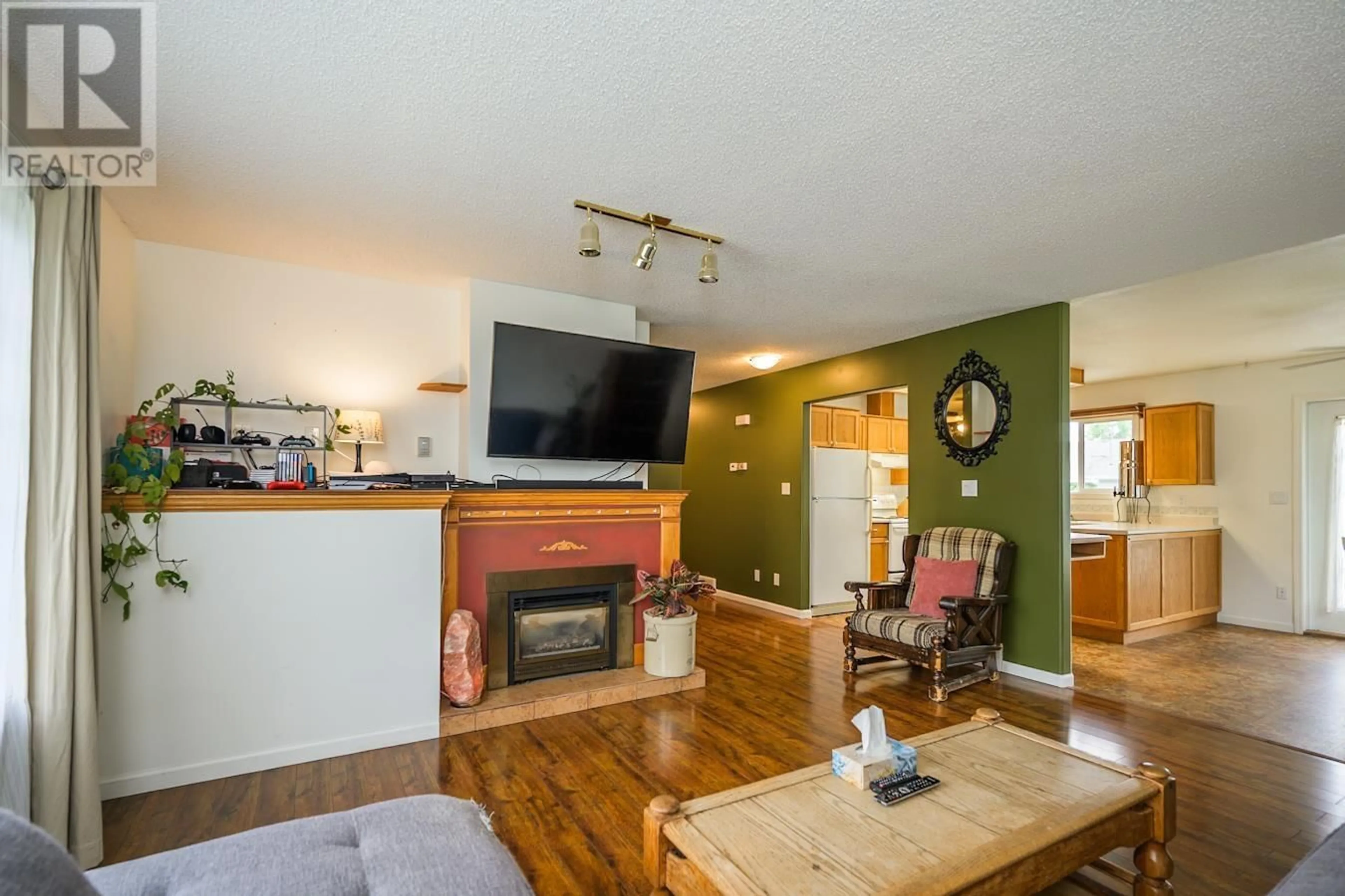 Living room with furniture, wood/laminate floor for 1861 BITTNER ROAD, Prince George British Columbia V2N6T1