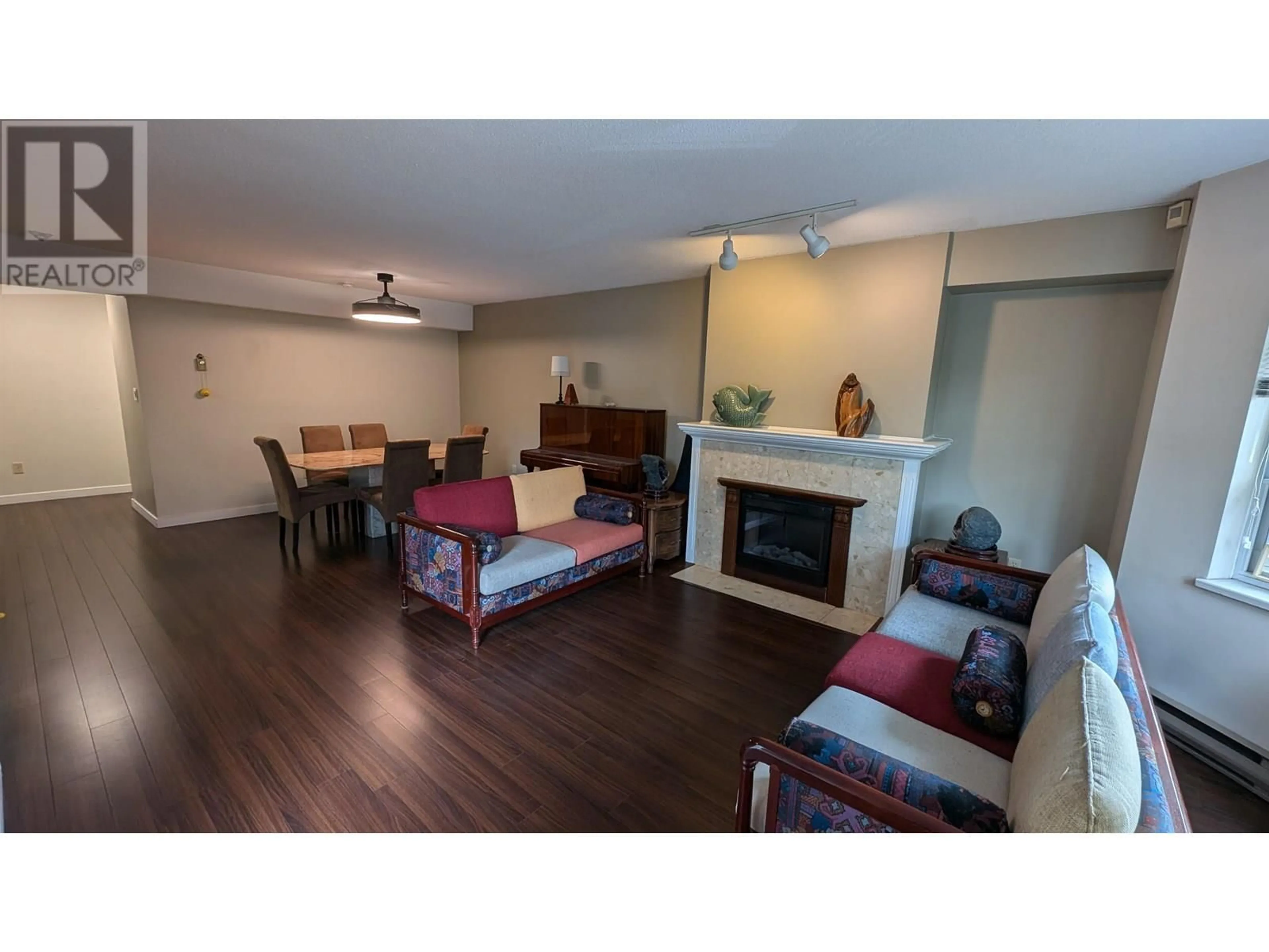 Living room with furniture, wood/laminate floor for 103 - 5700 ARCADIA ROAD, Richmond British Columbia V6X2G9
