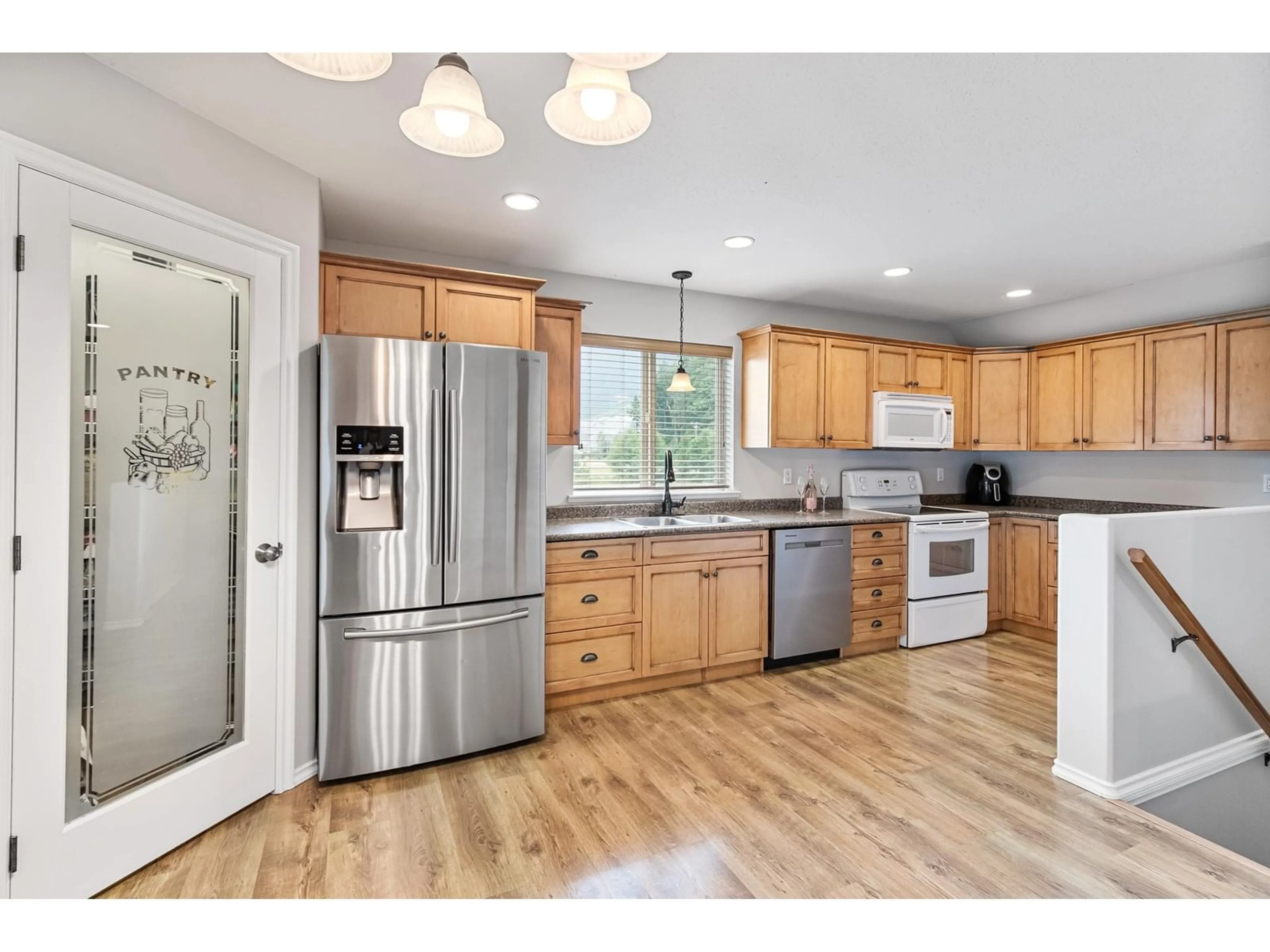 Open concept kitchen, wood/laminate floor for 5260 MCCALLUM ROAD, Agassiz British Columbia V0M1A3