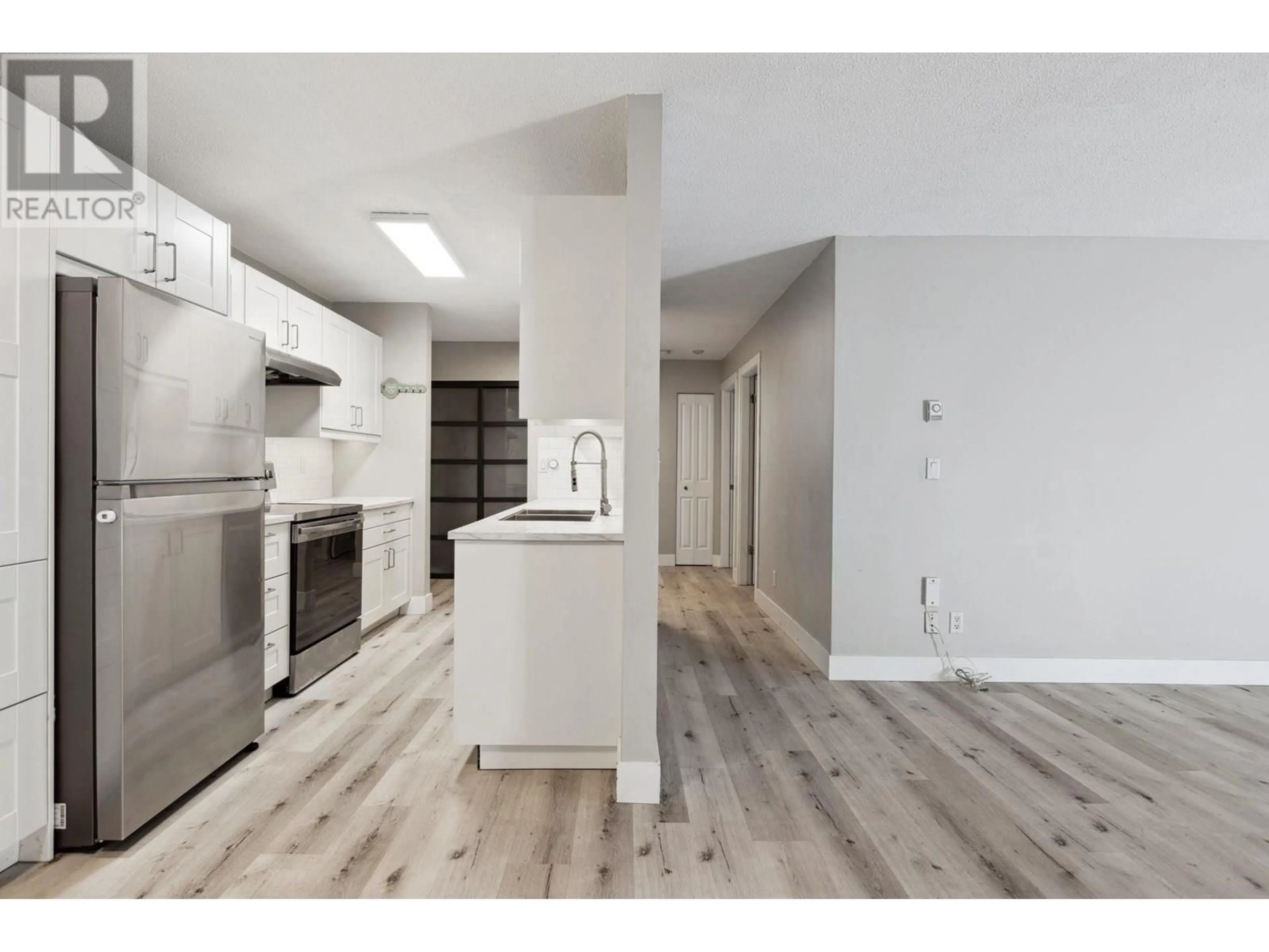 Open concept kitchen, wood/laminate floor for 110 - 4926 48 AVENUE, Ladner British Columbia V4K1V3