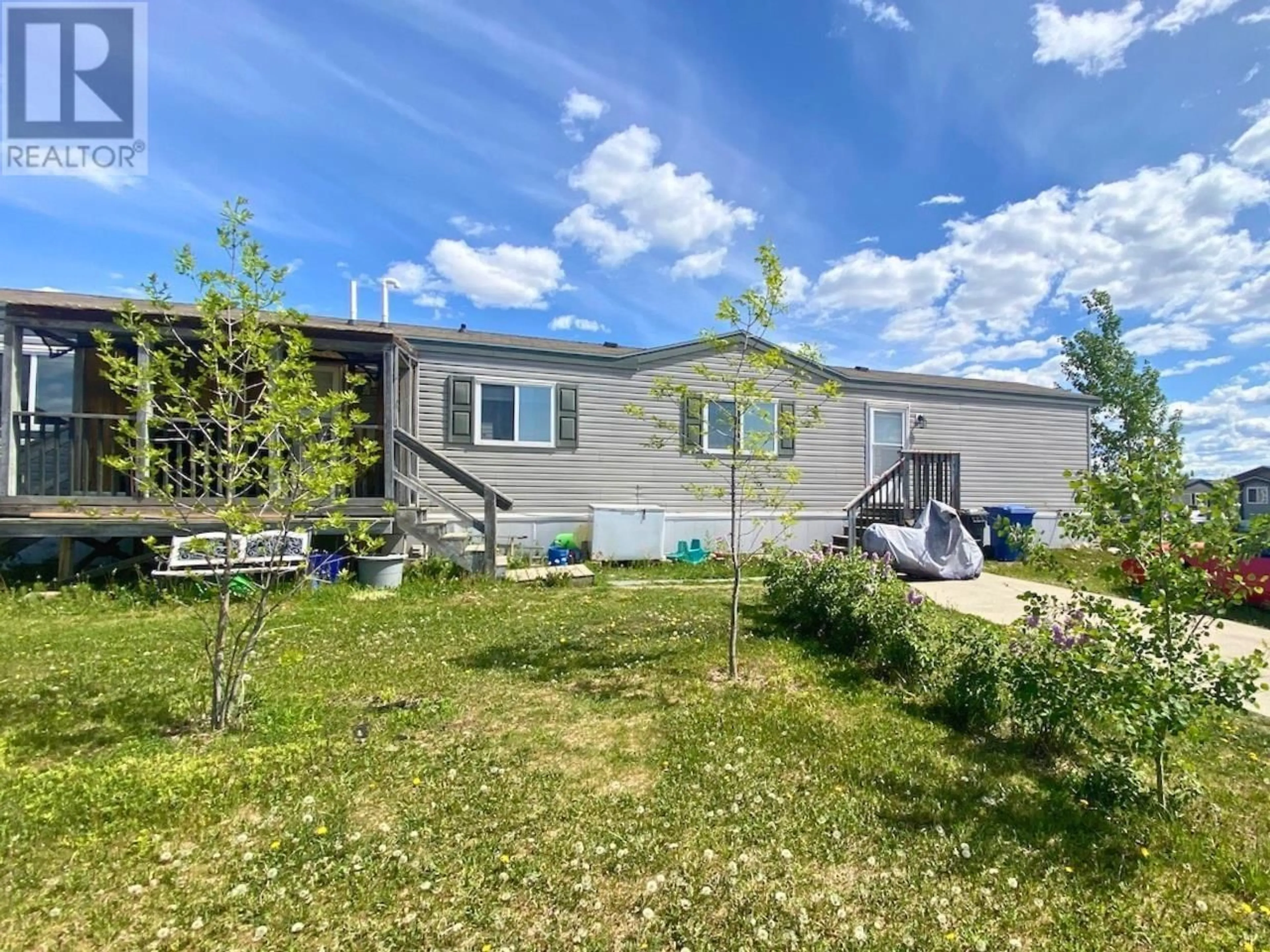 A pic from outside/outdoor area/front of a property/back of a property/a pic from drone, unknown for 7926 85A AVENUE, Fort St. John British Columbia V1J0H7