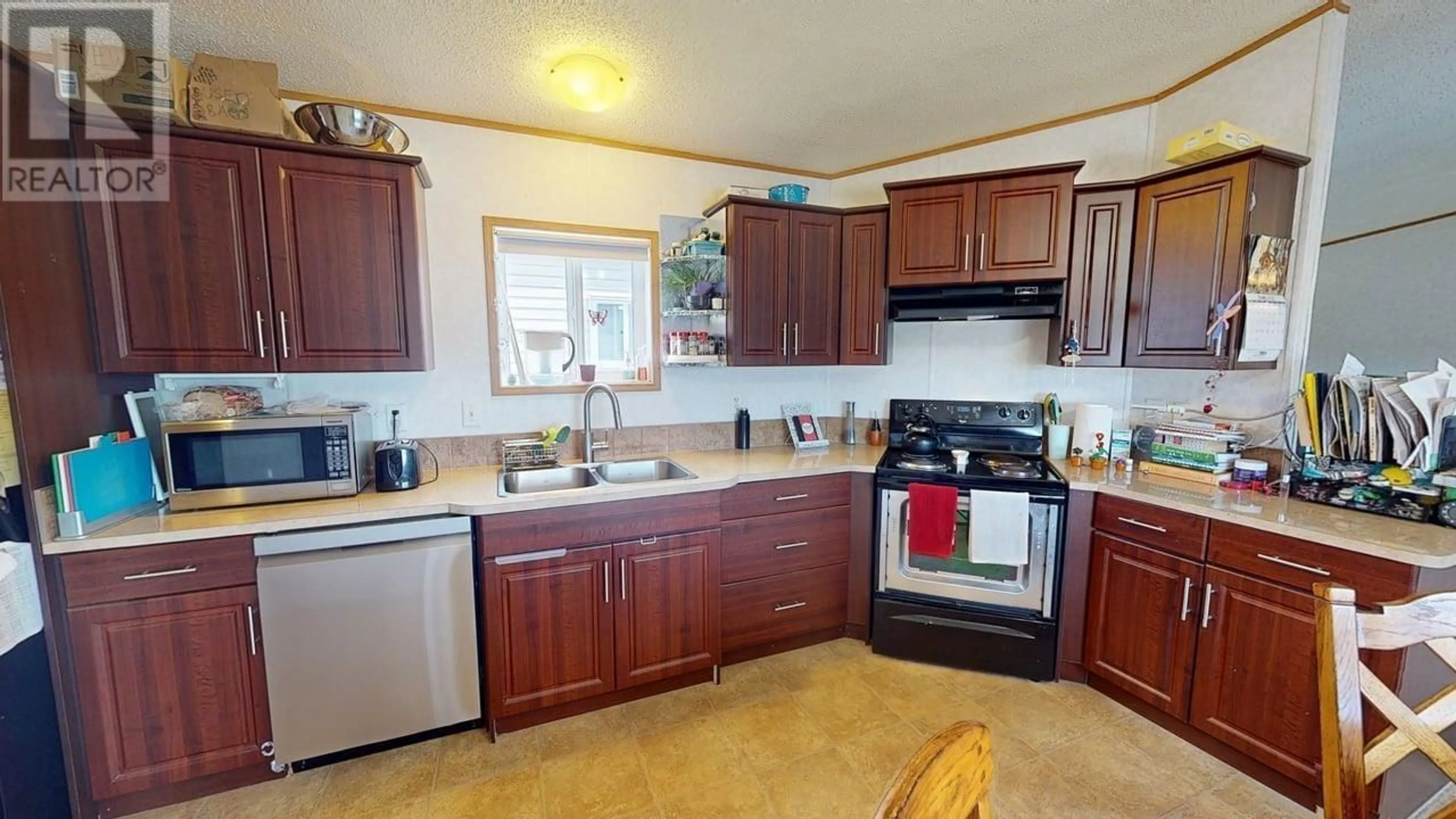 Standard kitchen, ceramic/tile floor for 7926 85A AVENUE, Fort St. John British Columbia V1J0H7