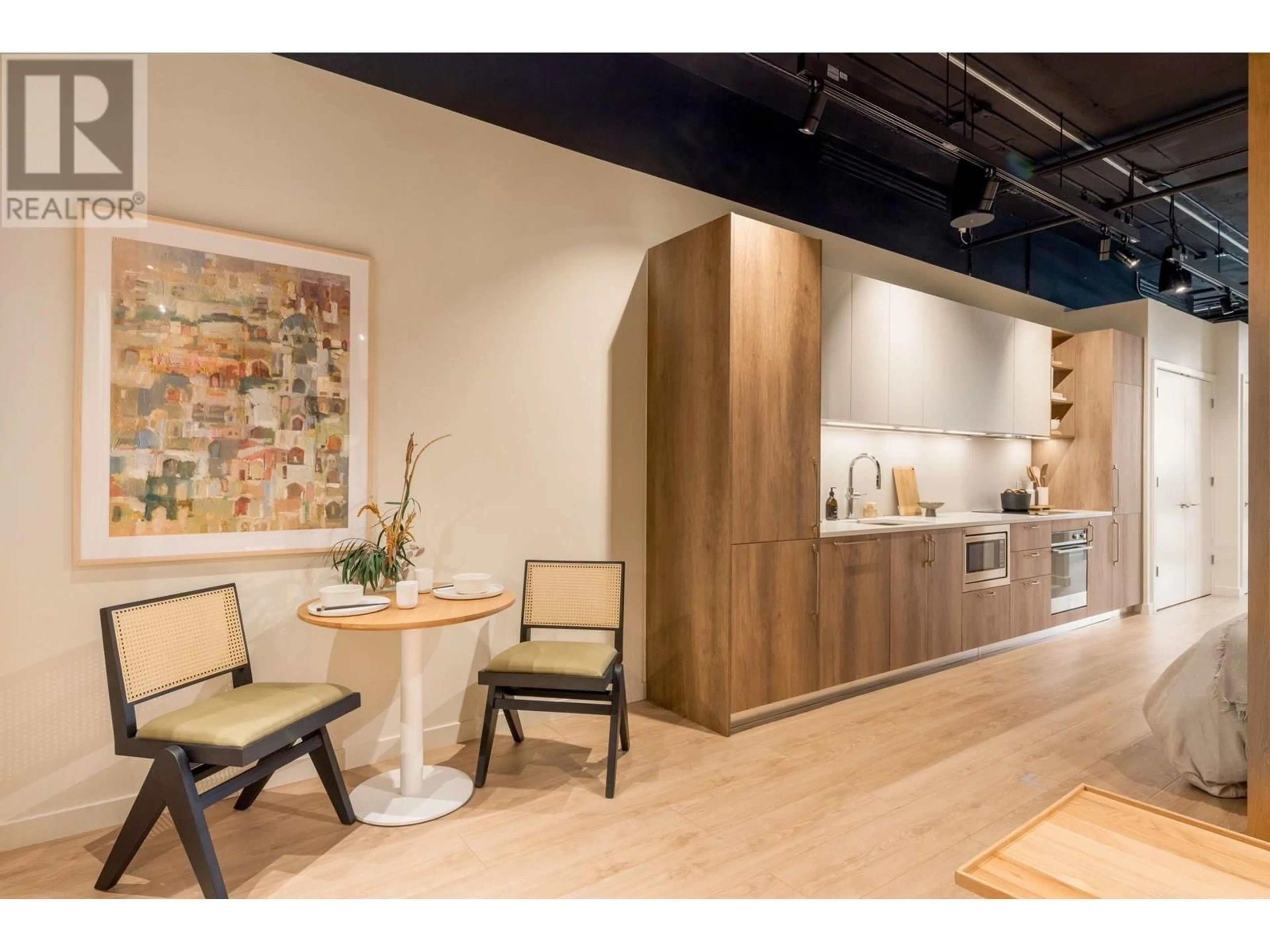 Open concept kitchen, wood/laminate floor for 312 - 133 49TH AVENUE, Vancouver British Columbia V5Z2S3