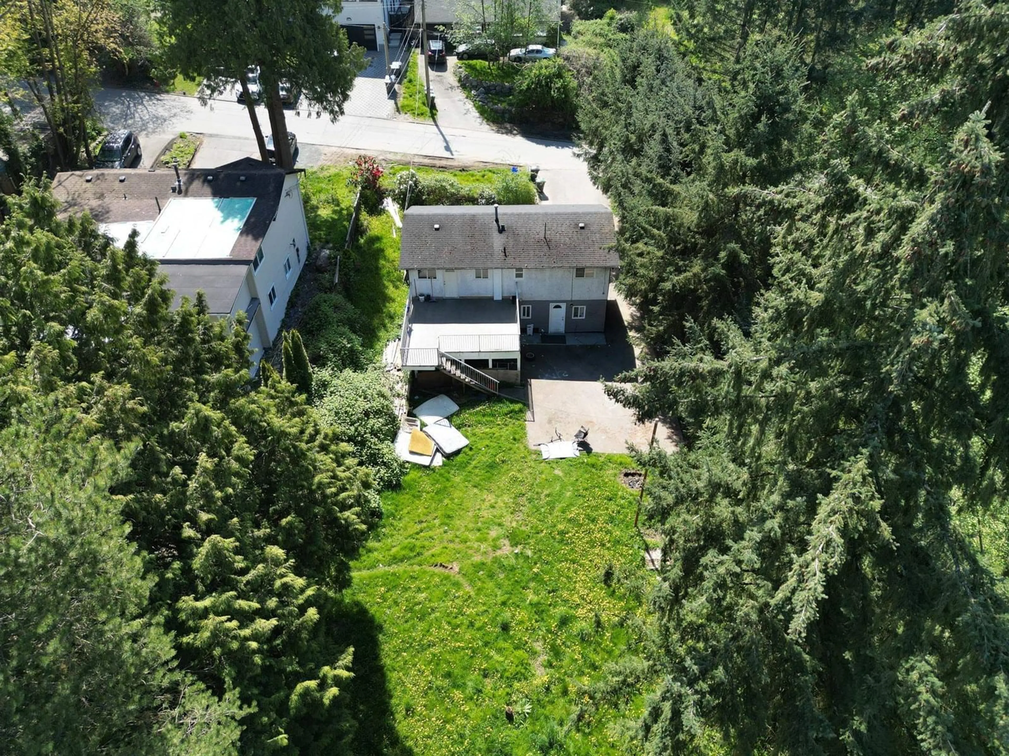 A pic from outside/outdoor area/front of a property/back of a property/a pic from drone, street for 12347 103A, Surrey British Columbia V3V3H1