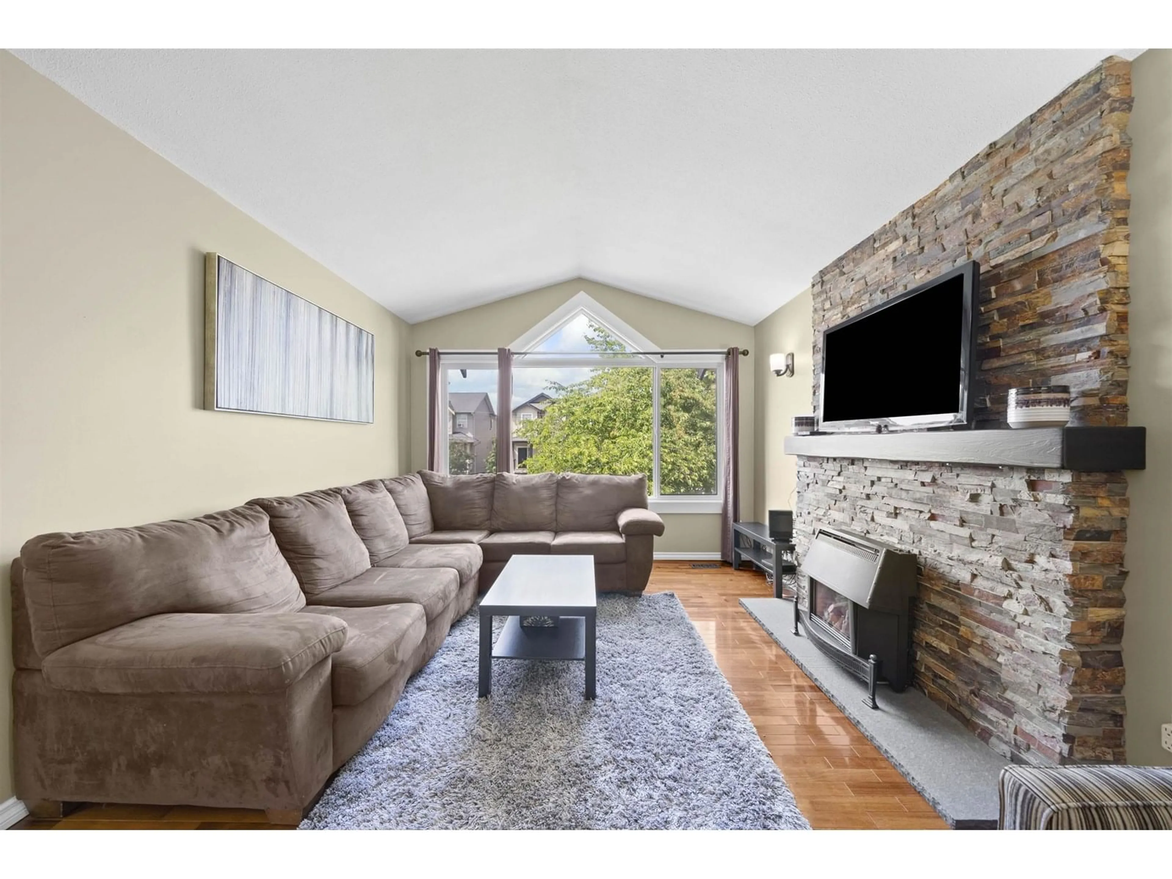 Living room with furniture, wood/laminate floor for 34776 1, Abbotsford British Columbia V2S8C2