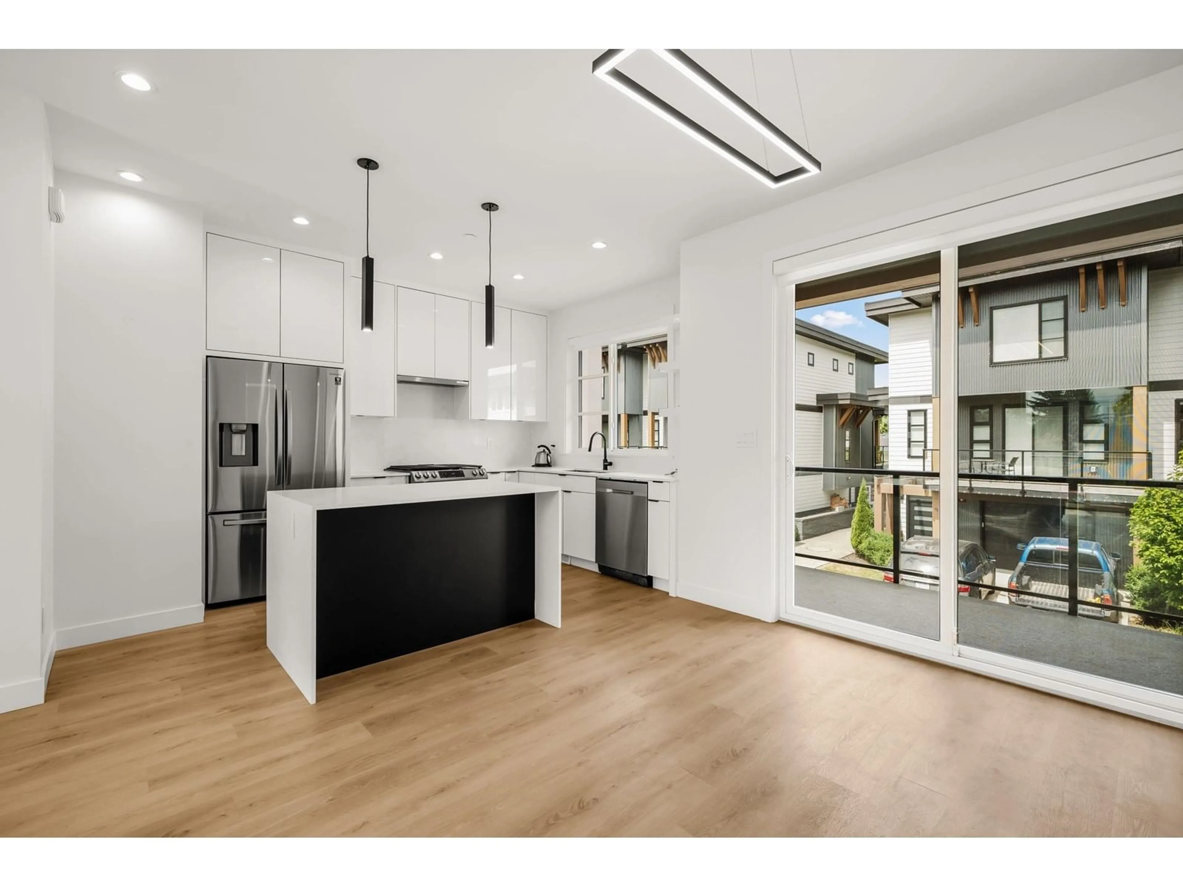 Open concept kitchen, wood/laminate floor for 4 - 45437 SPADINA AVENUE, Chilliwack British Columbia V2P0J9