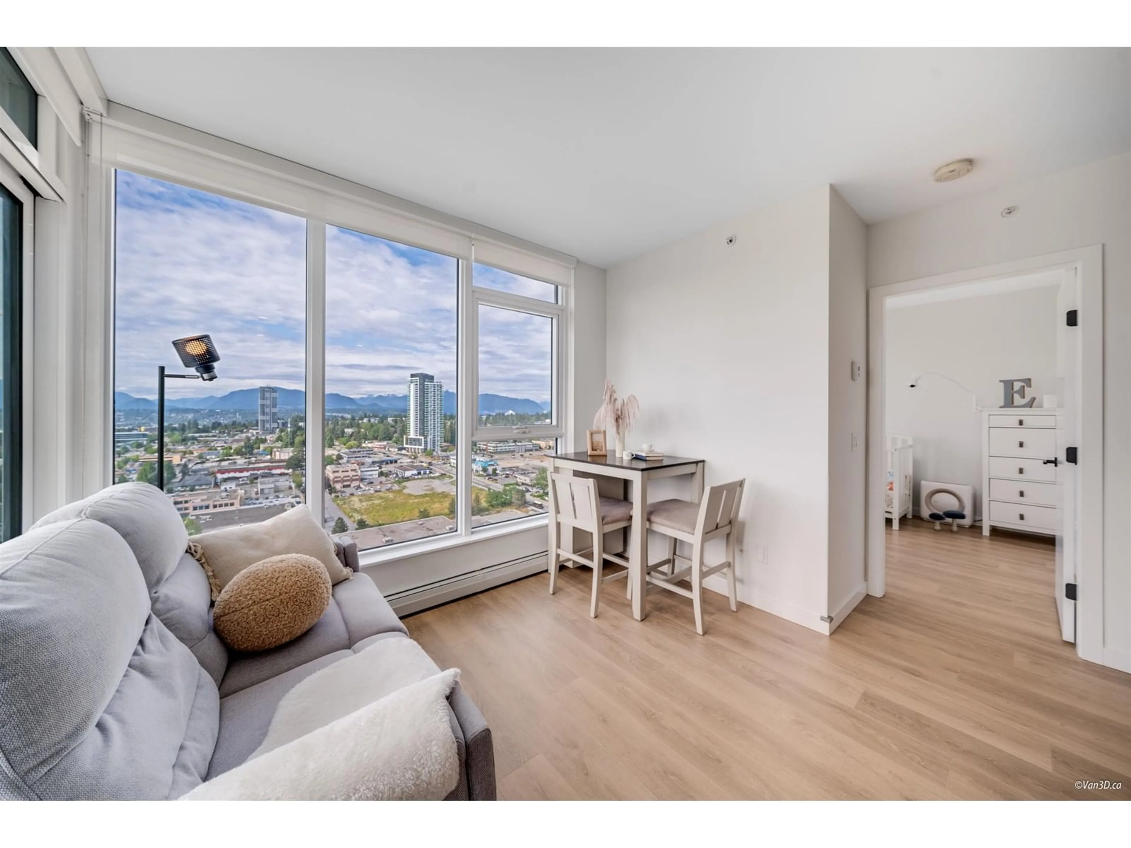 Living room with furniture, wood/laminate floor for 2211 - 13685 102, Surrey British Columbia V3T0S2