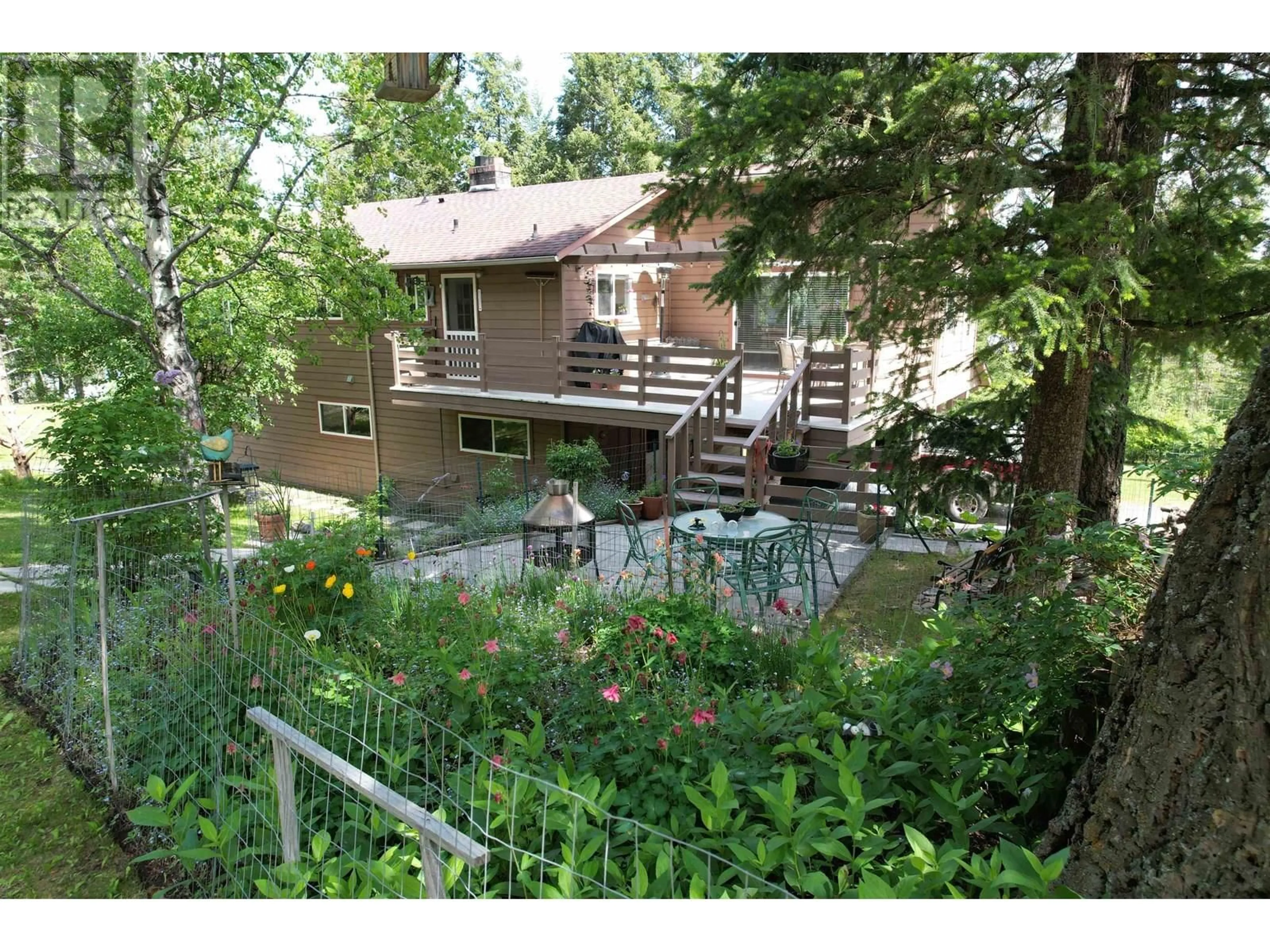 A pic from outside/outdoor area/front of a property/back of a property/a pic from drone, forest/trees view for 6472 EWEN ROAD, 100 Mile House British Columbia V0K2E3