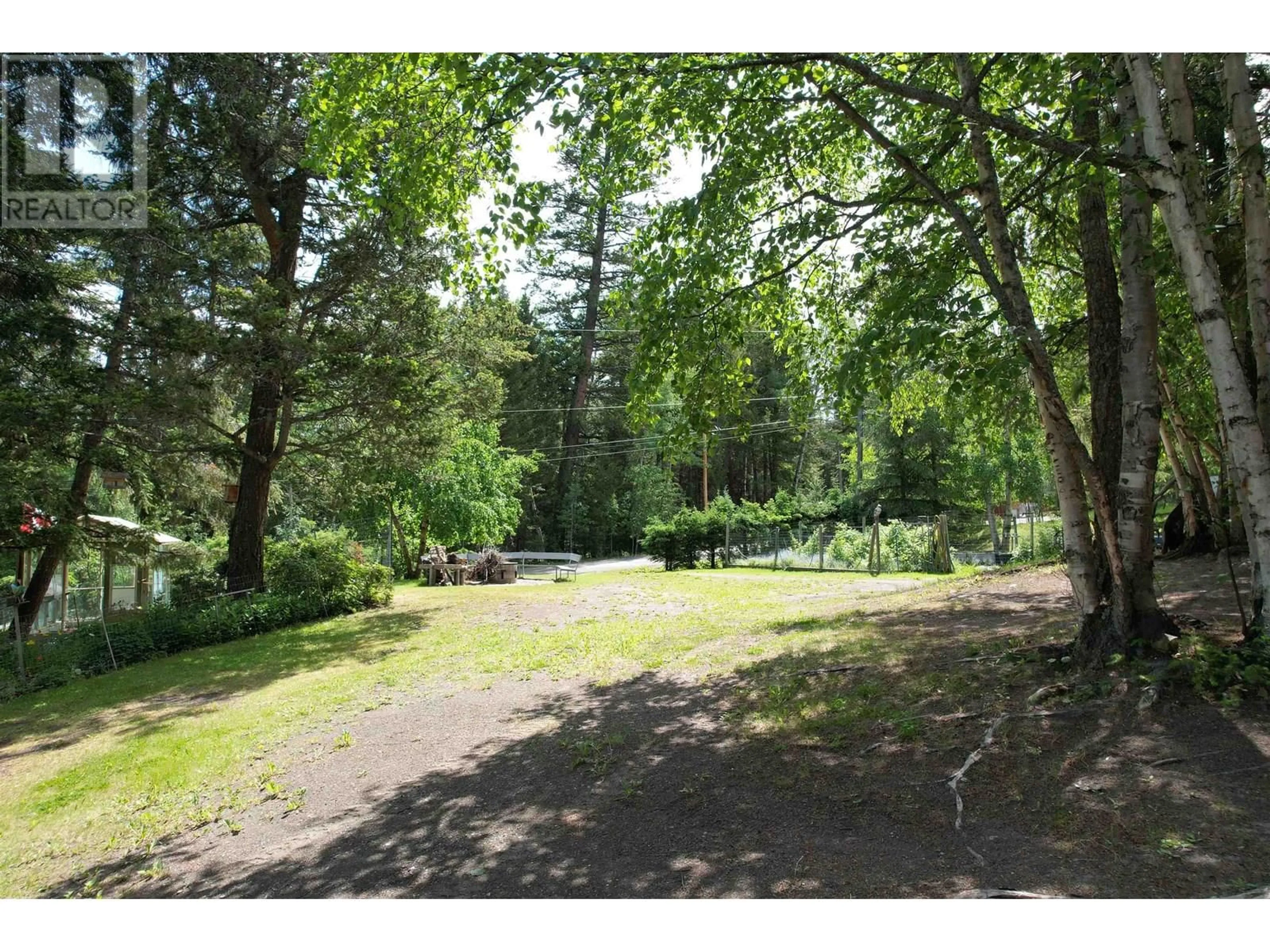A pic from outside/outdoor area/front of a property/back of a property/a pic from drone, forest/trees view for 6472 EWEN ROAD, 100 Mile House British Columbia V0K2E3