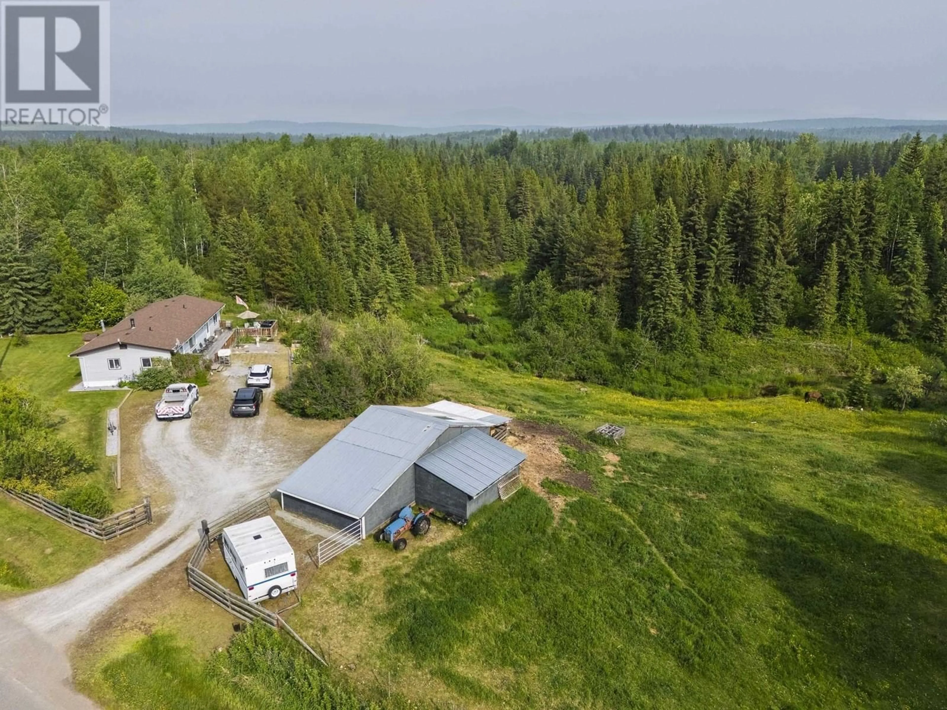A pic from outside/outdoor area/front of a property/back of a property/a pic from drone, forest/trees view for 23700 RED ROCK ROAD, Prince George British Columbia V2N5Z1