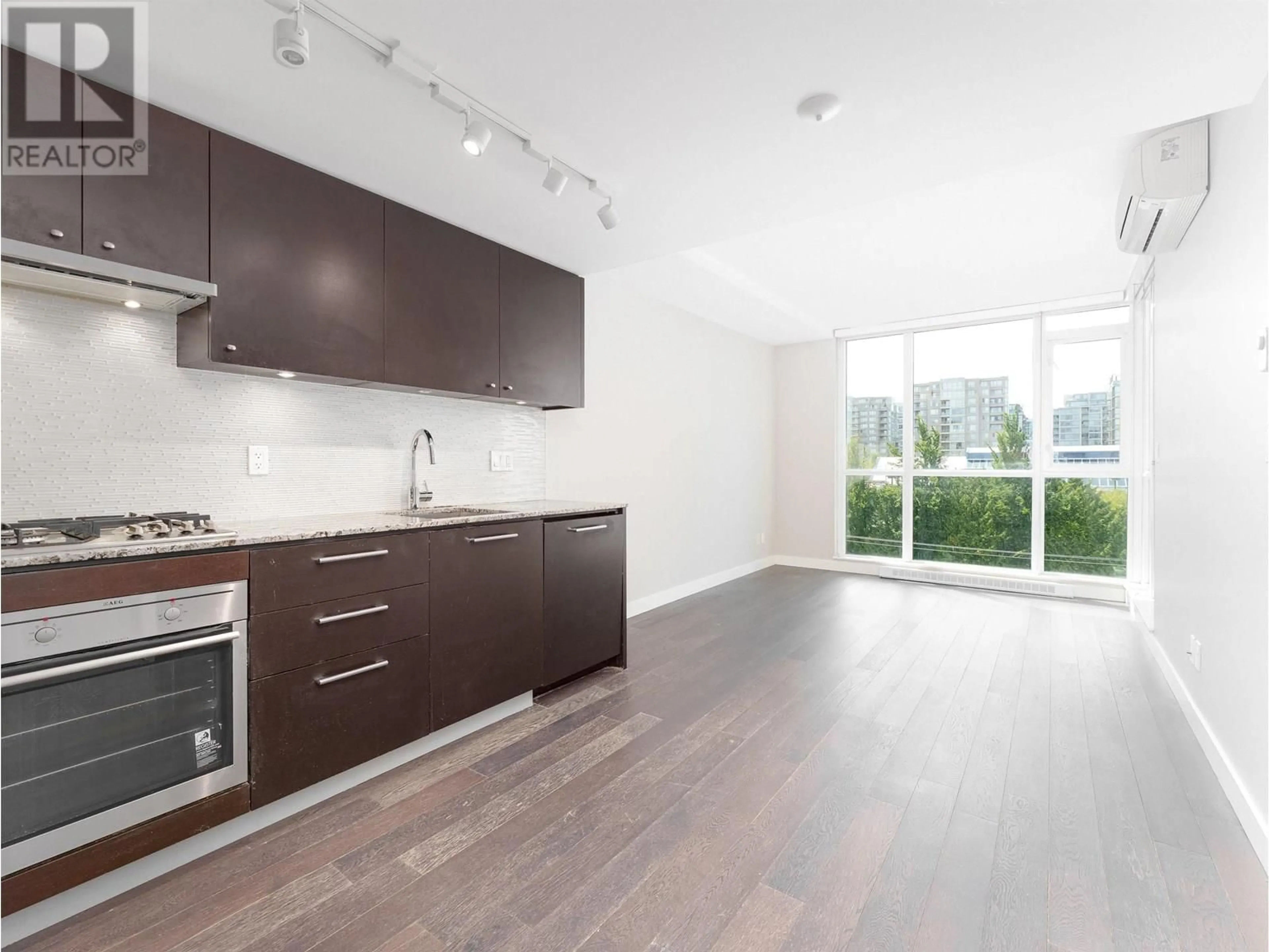Open concept kitchen, wood/laminate floor for 706 - 6180 COONEY ROAD, Richmond British Columbia V6Y0H2