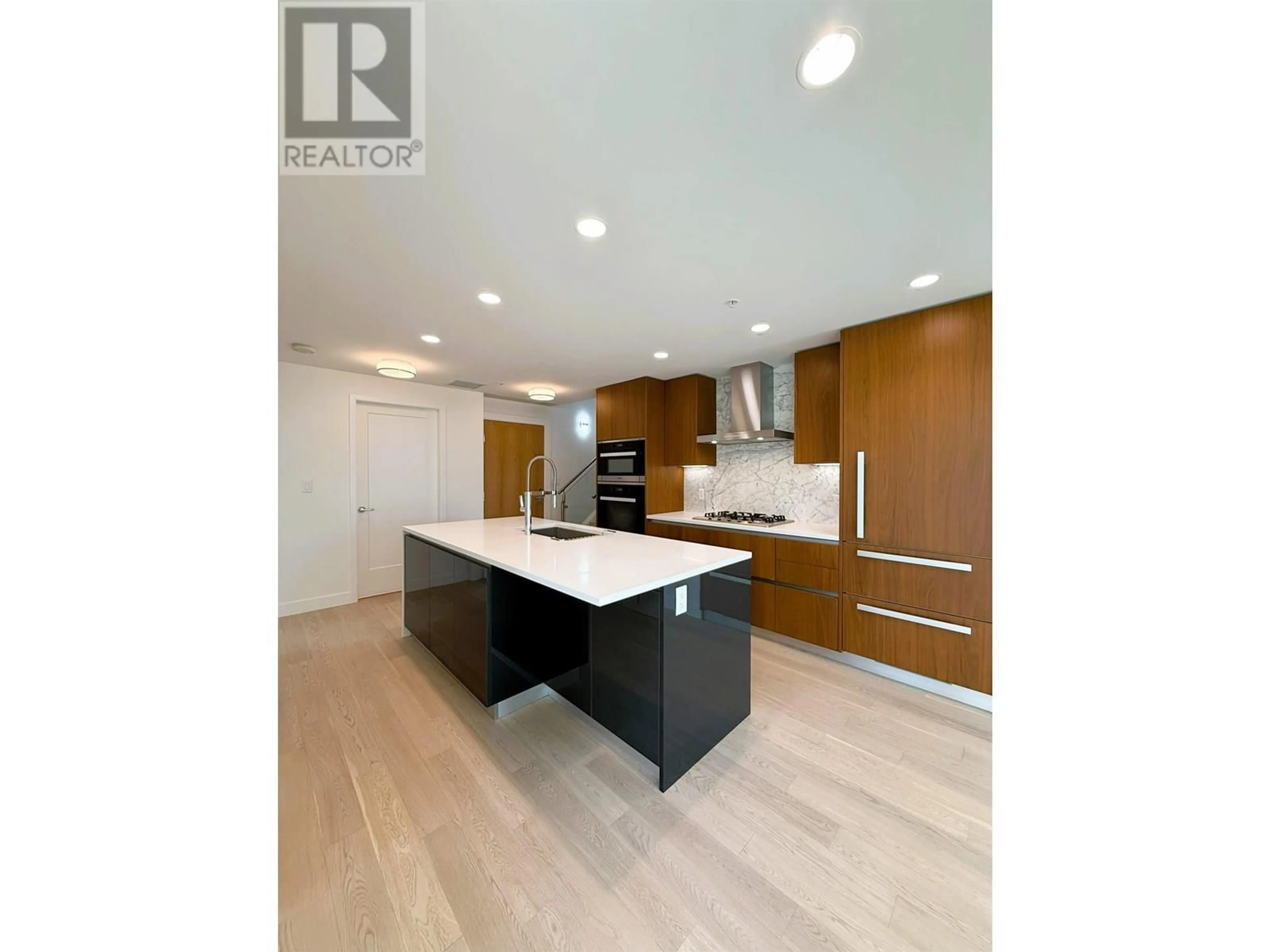 Open concept kitchen, wood/laminate floor for 404 - 2888 ARBUTUS STREET, Vancouver British Columbia V6J3Y7