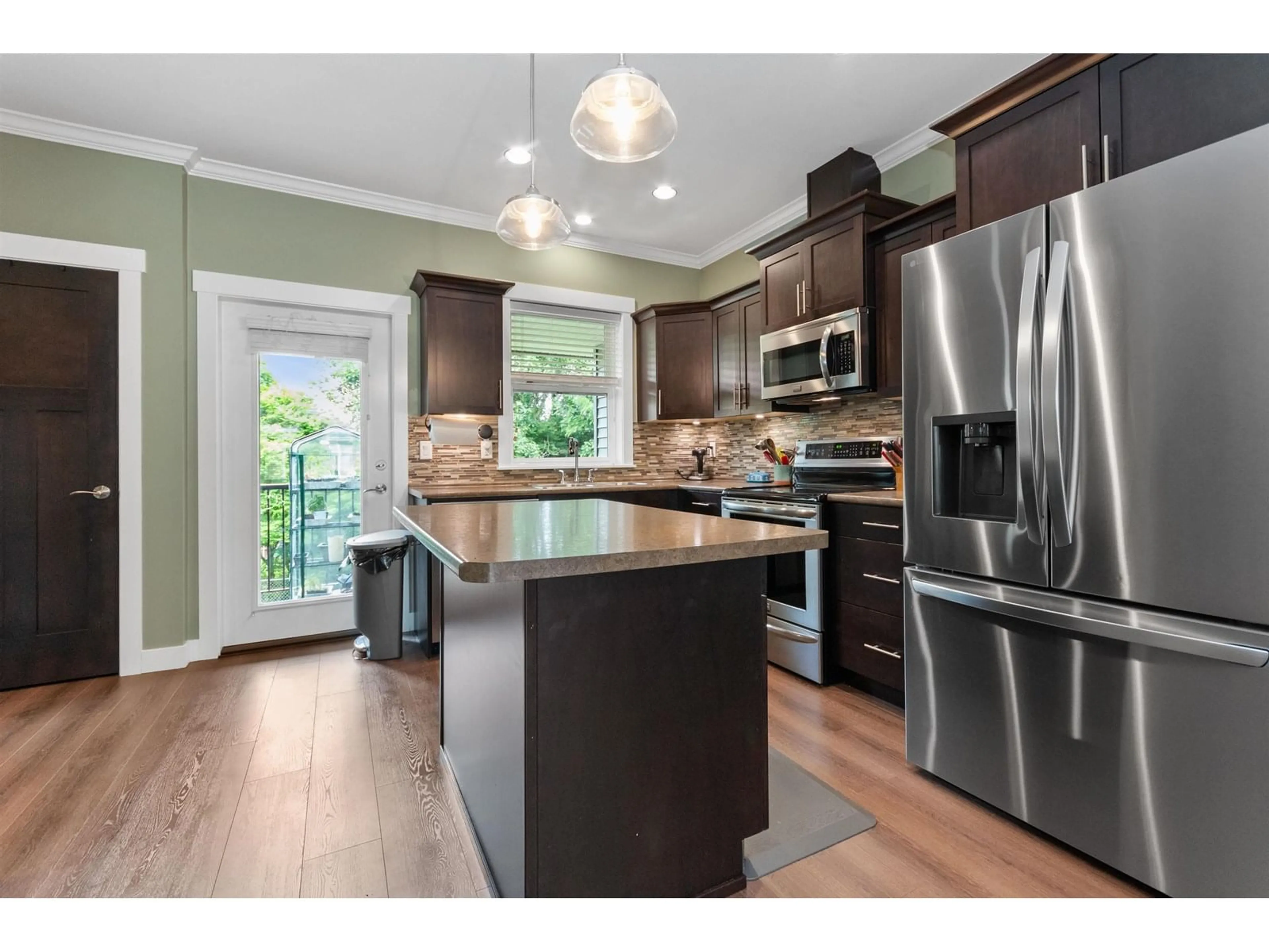 Open concept kitchen, wood/laminate floor for 22 - 7428 EVANS ROAD, Chilliwack British Columbia V2R0S5
