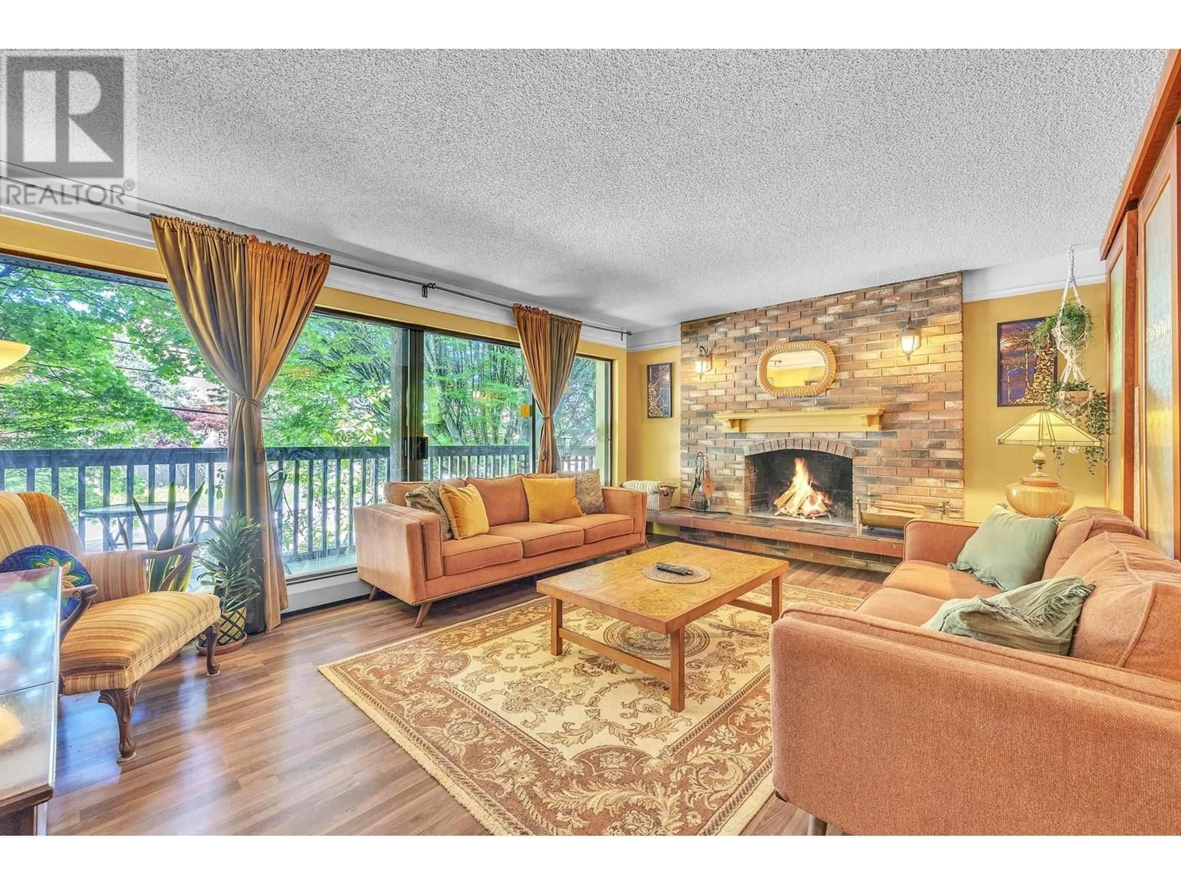 Living room with furniture, wood/laminate floor for 207 - 720 EIGHTH AVENUE, New Westminster British Columbia V3M2R3