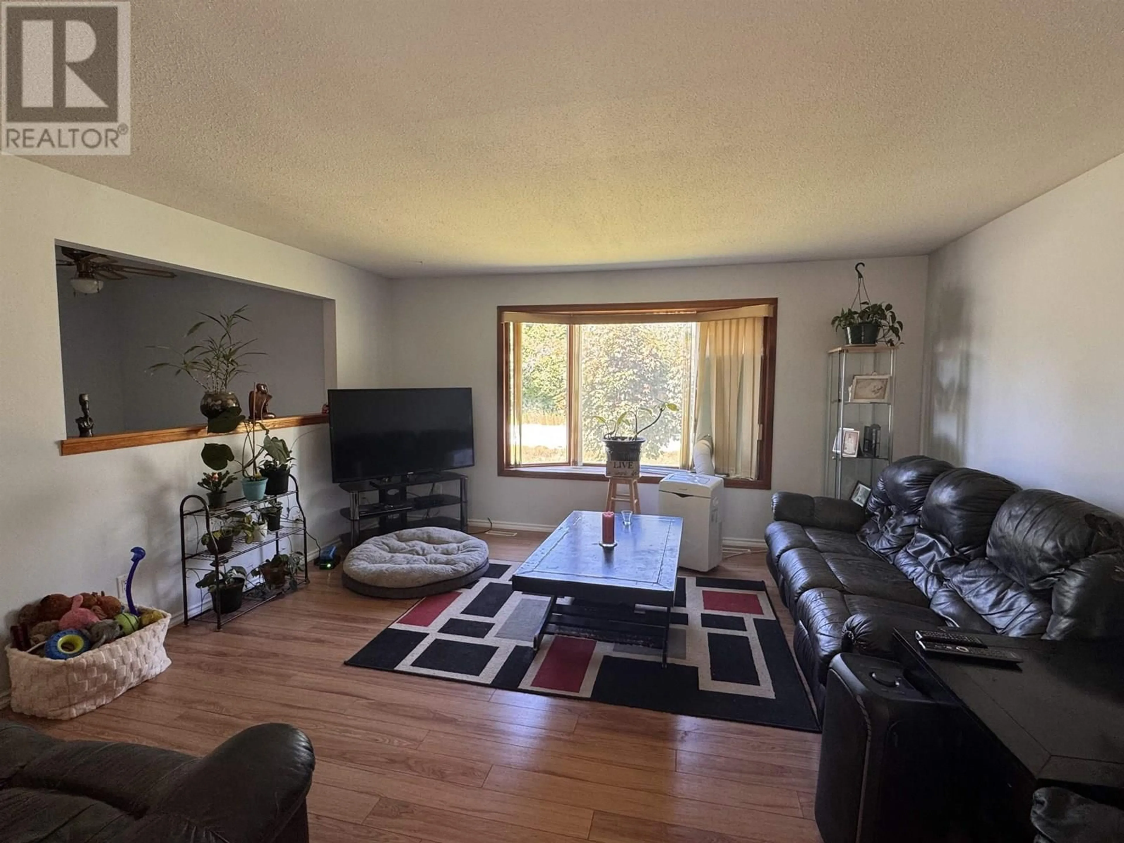 Living room with furniture, wood/laminate floor for 3503 OLD LAKELSE LAKE DRIVE, Terrace British Columbia V8G5J9