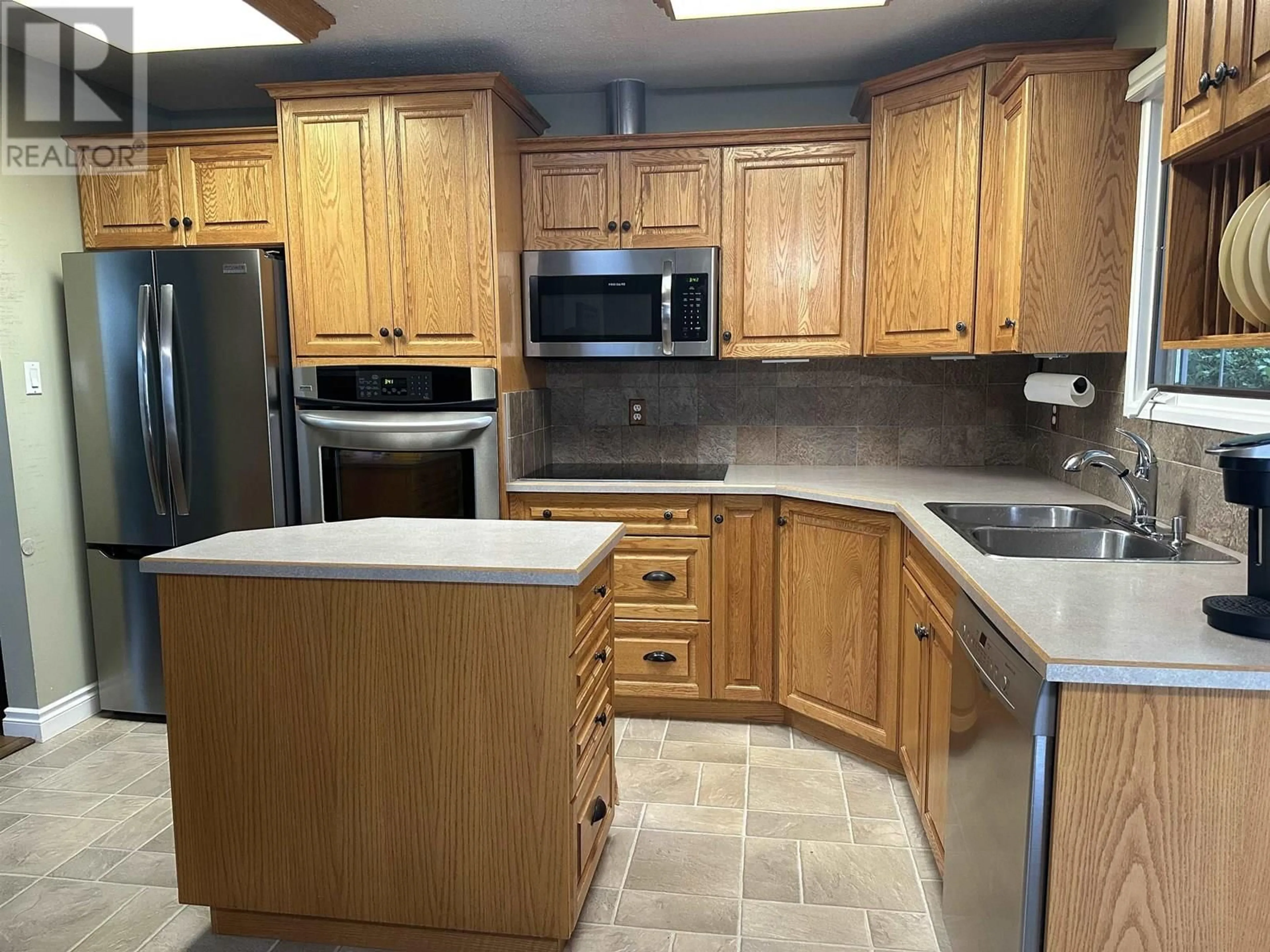 Standard kitchen, ceramic/tile floor for 9507 103 AVENUE, Fort St. John British Columbia V1J2G7