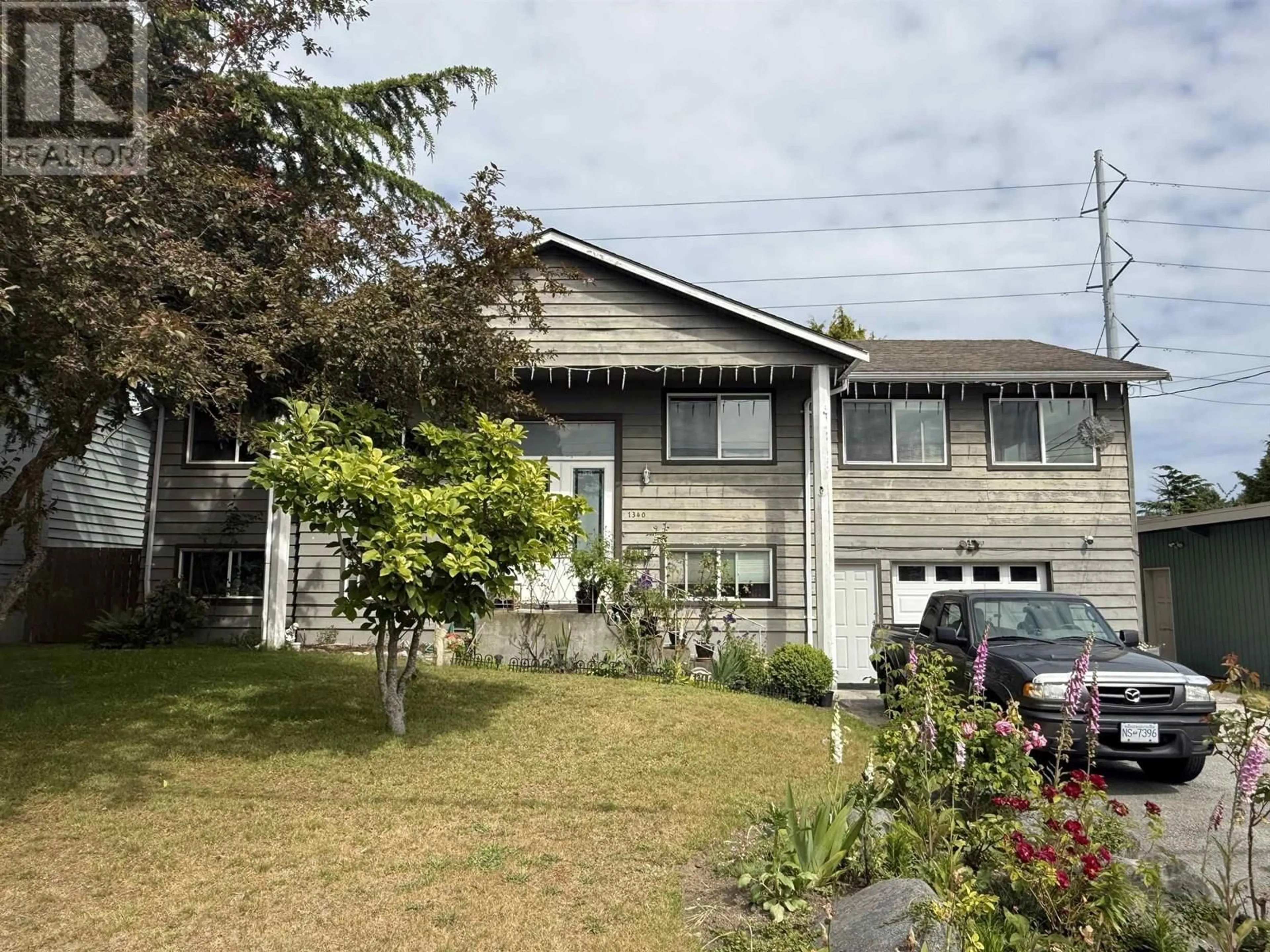 A pic from outside/outdoor area/front of a property/back of a property/a pic from drone, street for 1340 53A STREET, Delta British Columbia V4M3E6
