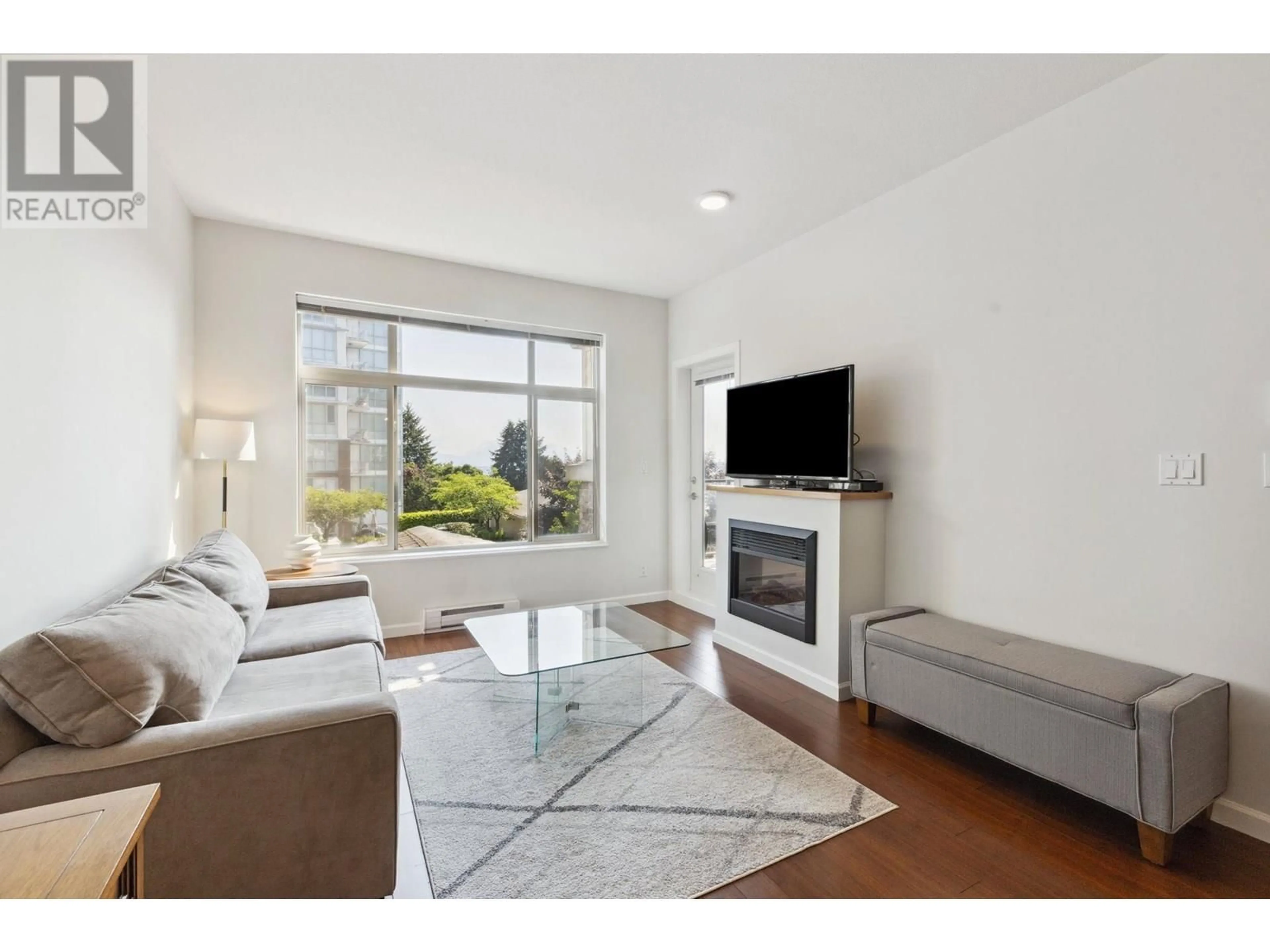 Living room with furniture, unknown for 310 - 290 FRANCIS WAY, New Westminster British Columbia V3L0C4