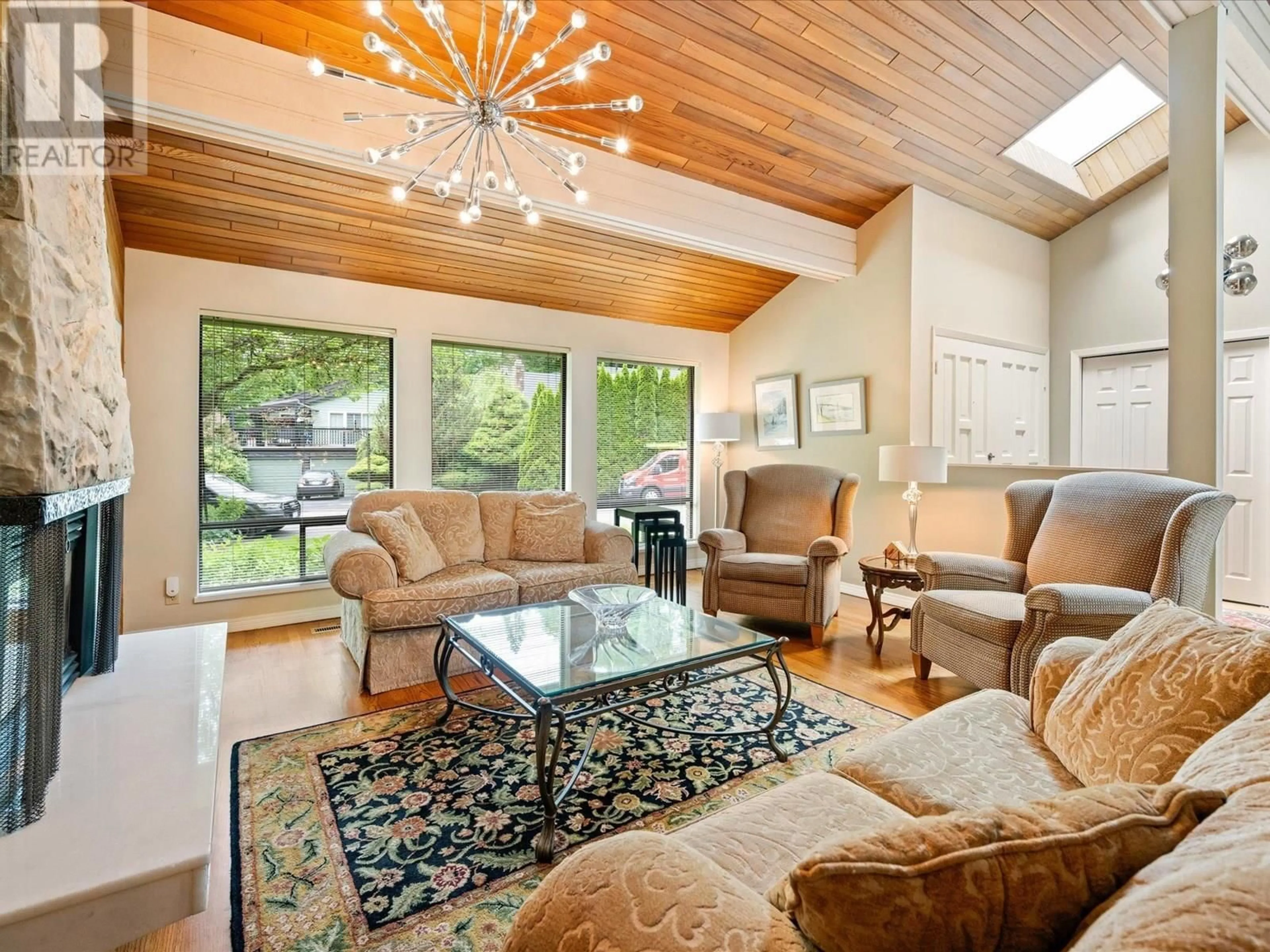 Living room with furniture, wood/laminate floor for 5436 BLUEBERRY LANE, North Vancouver British Columbia V7R4N1