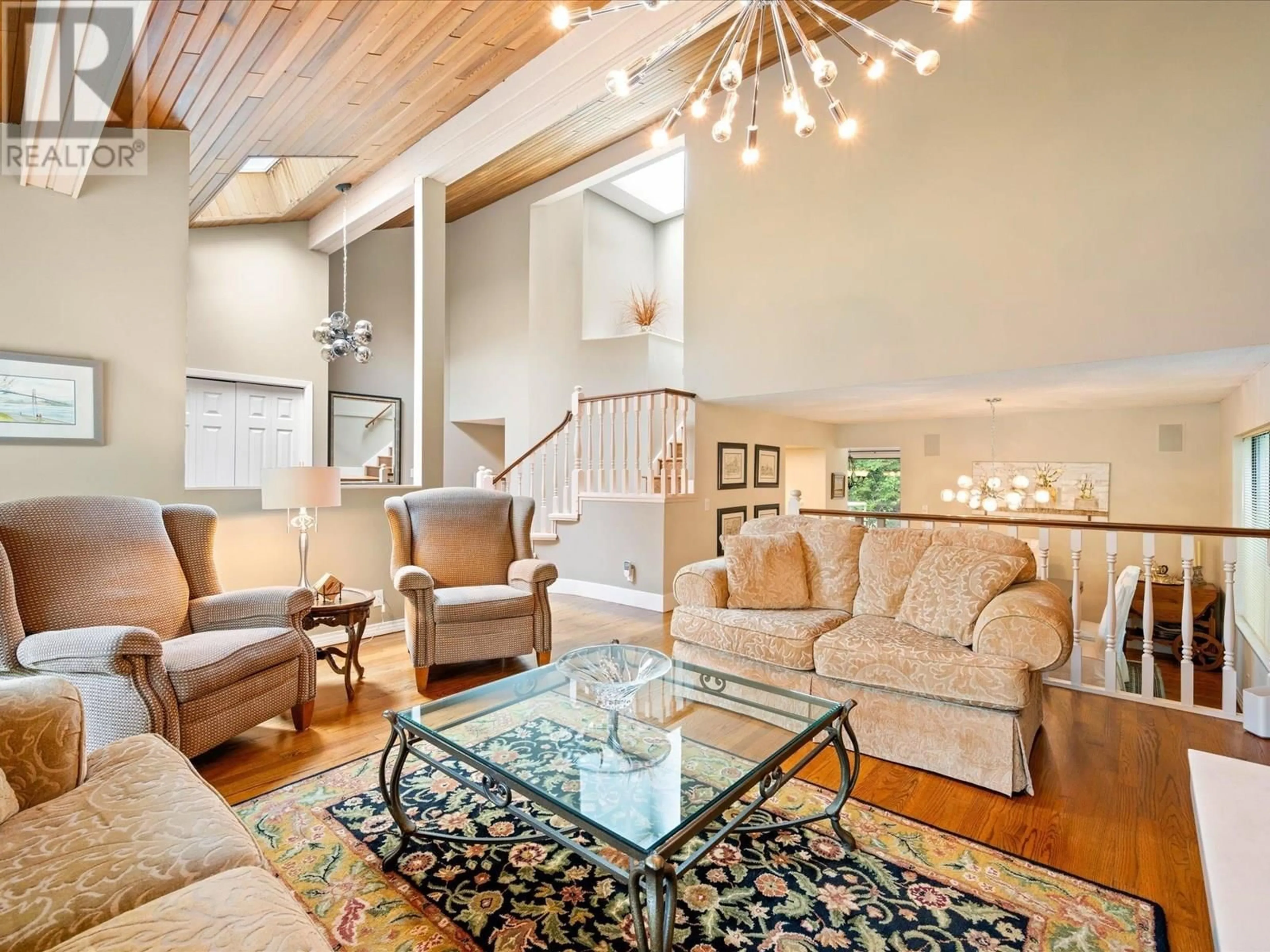 Living room with furniture, wood/laminate floor for 5436 BLUEBERRY LANE, North Vancouver British Columbia V7R4N1