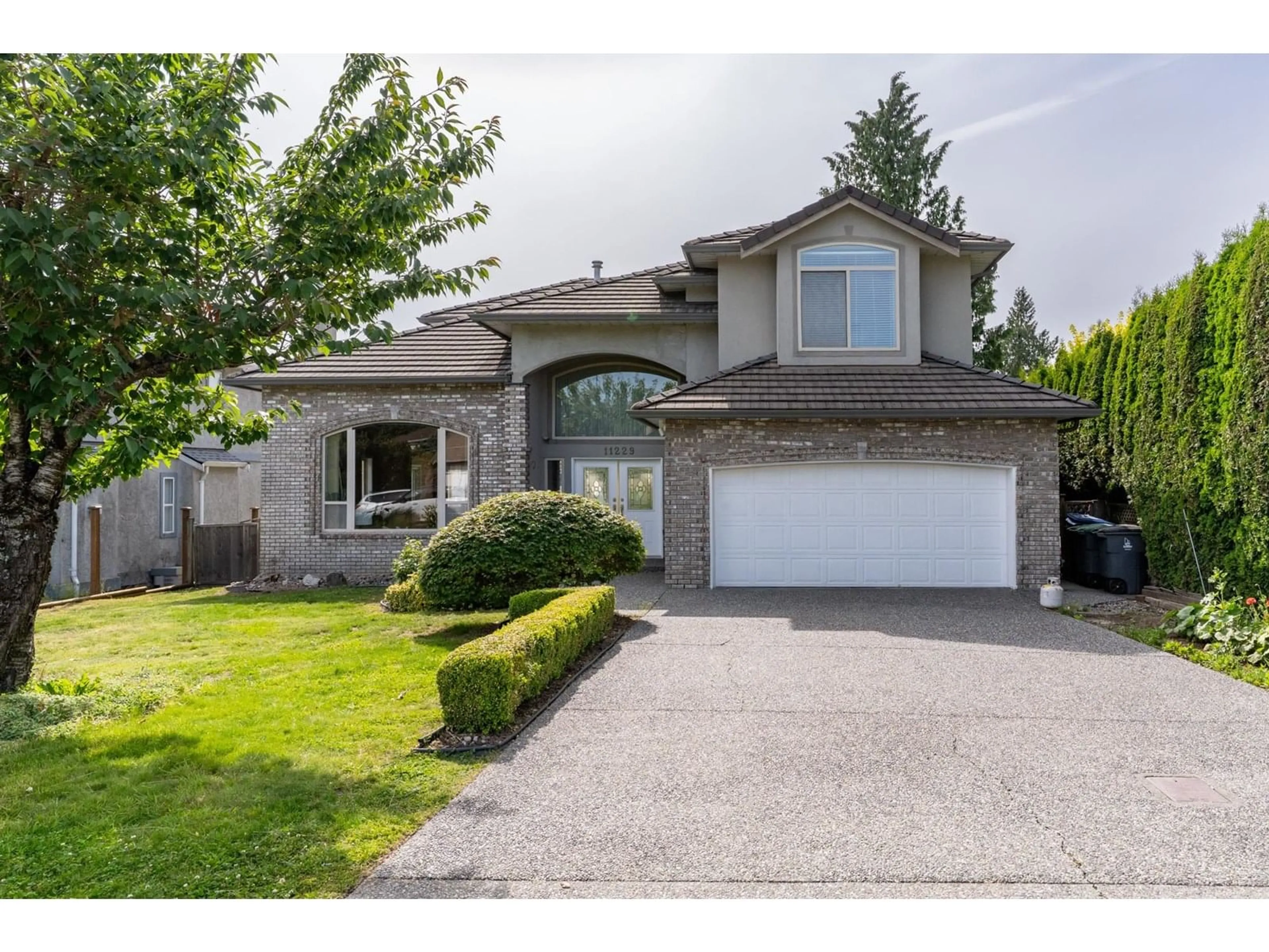 Home with vinyl exterior material, street for 11229 154A, Surrey British Columbia V3R6J4